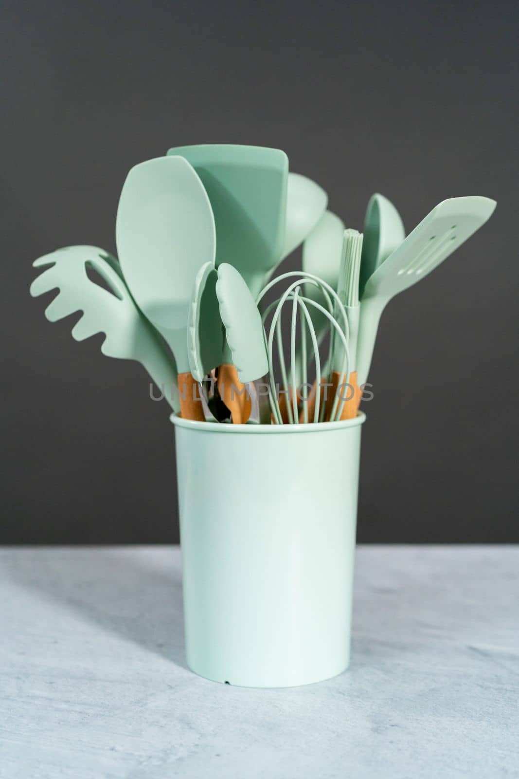 Silicone cooking utensils with wooden handle.