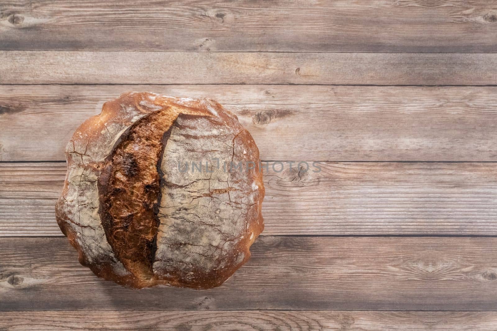 Flat lay. Freshly baked sourdough rye loaf of bread.