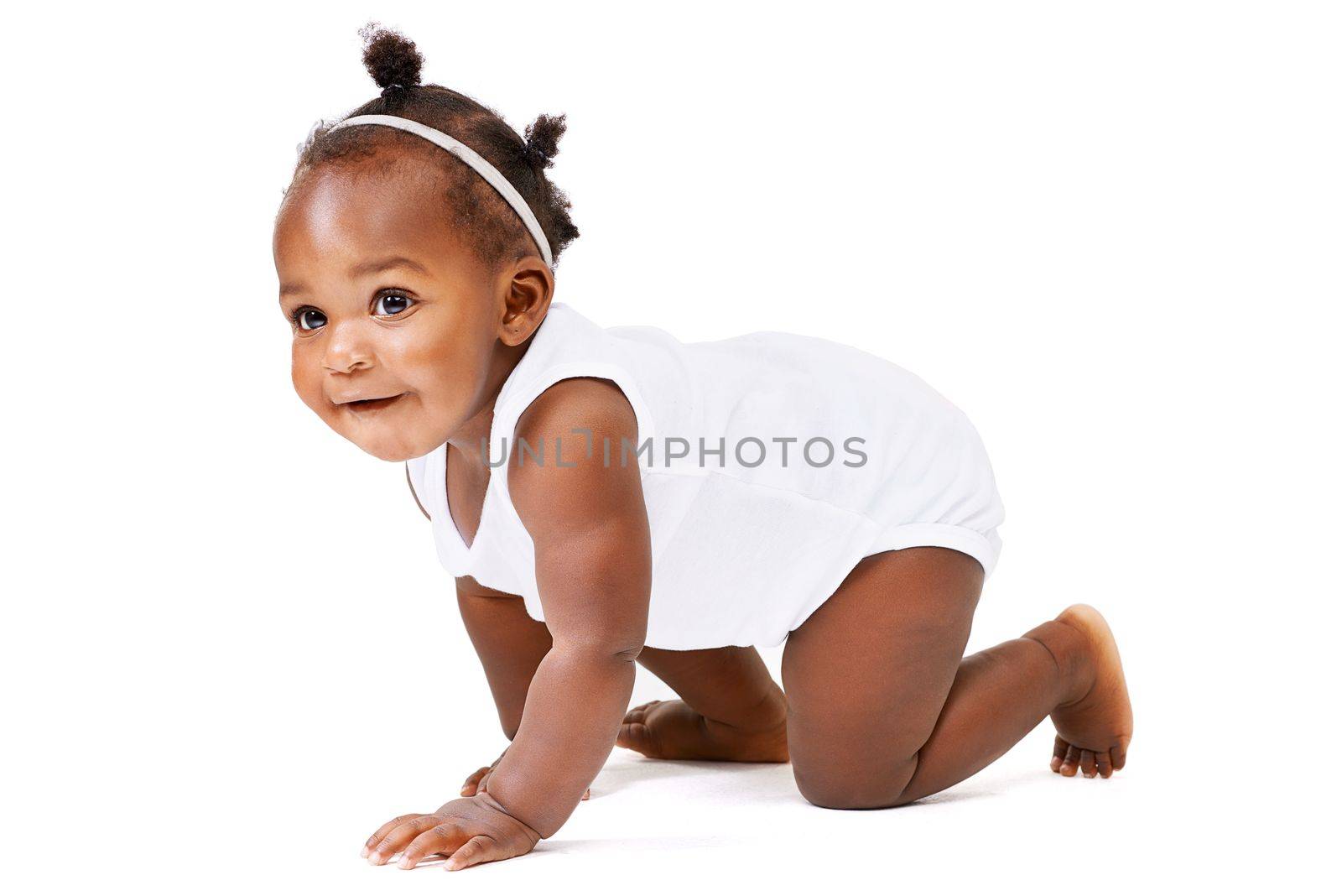 Fun and adventure awaits...Studio shot of a baby girl crawling against a white background