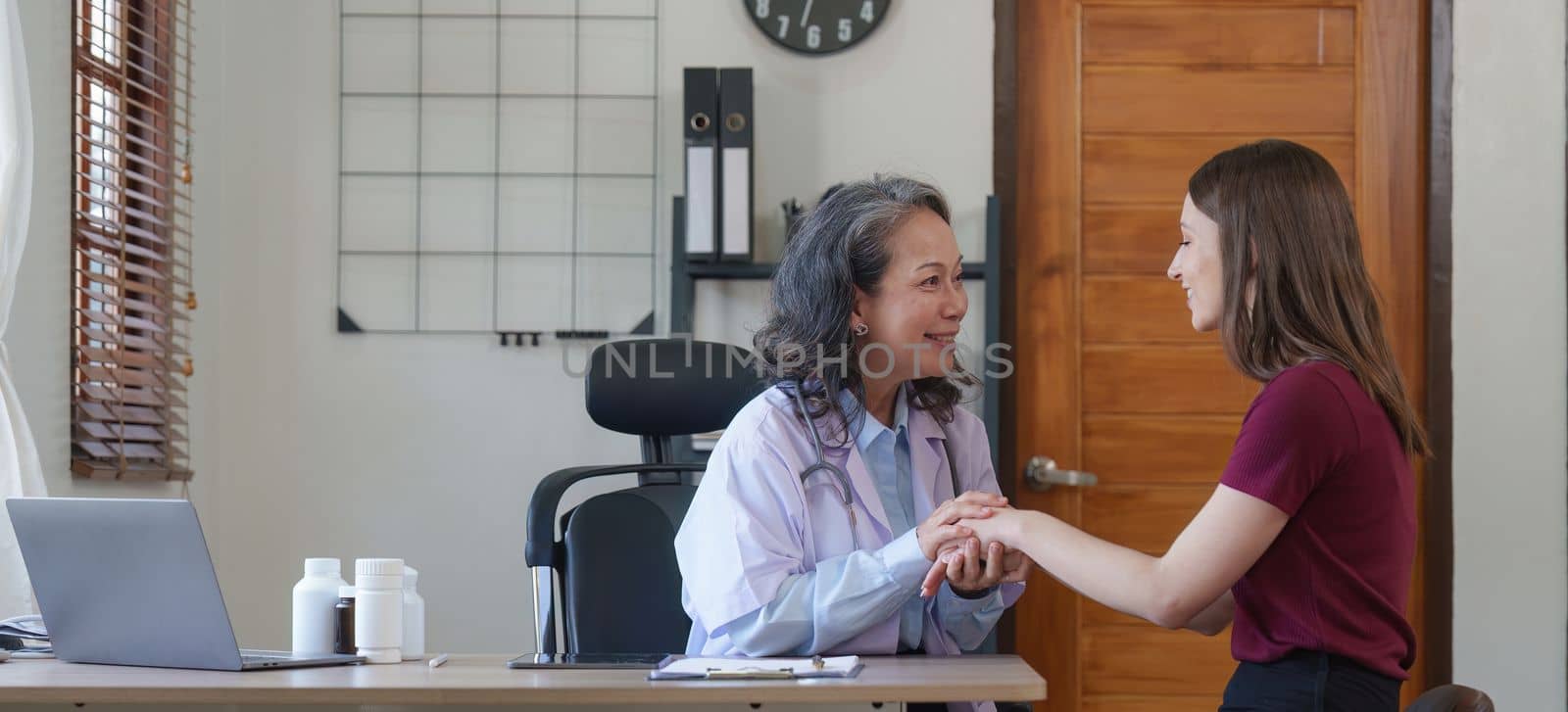 Home healthcare nurse, physical therapy with senior adult woman at home. Doctor holding hand woman.