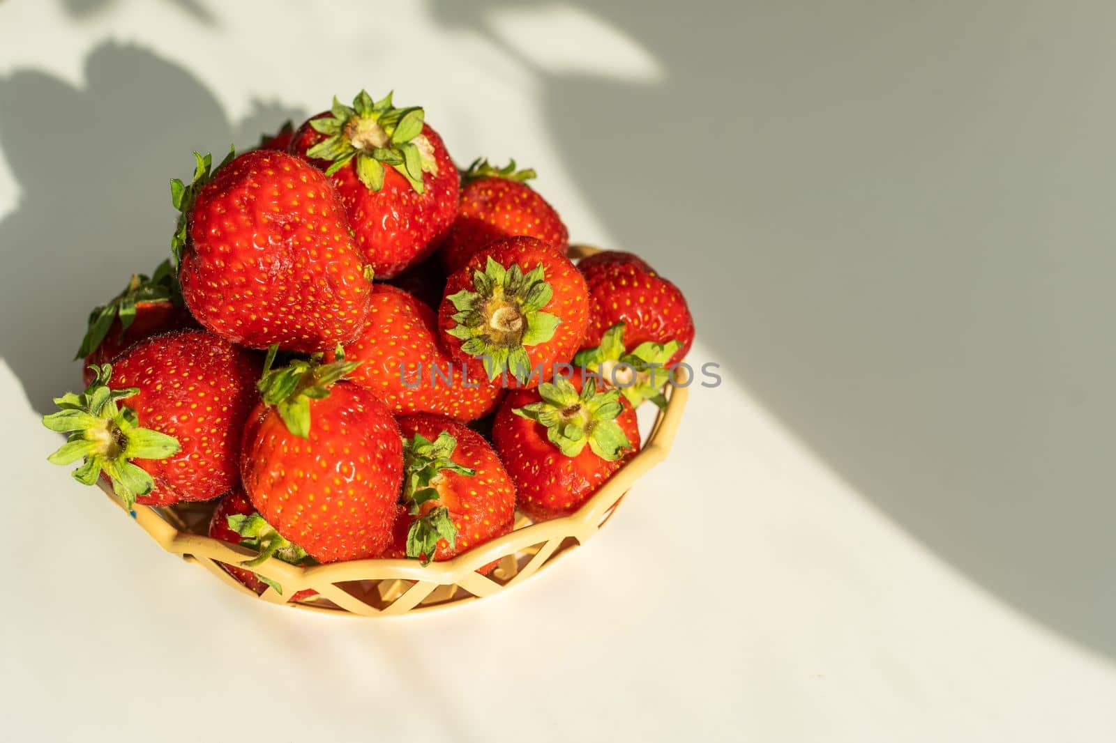strawberries in a wicker plate.
