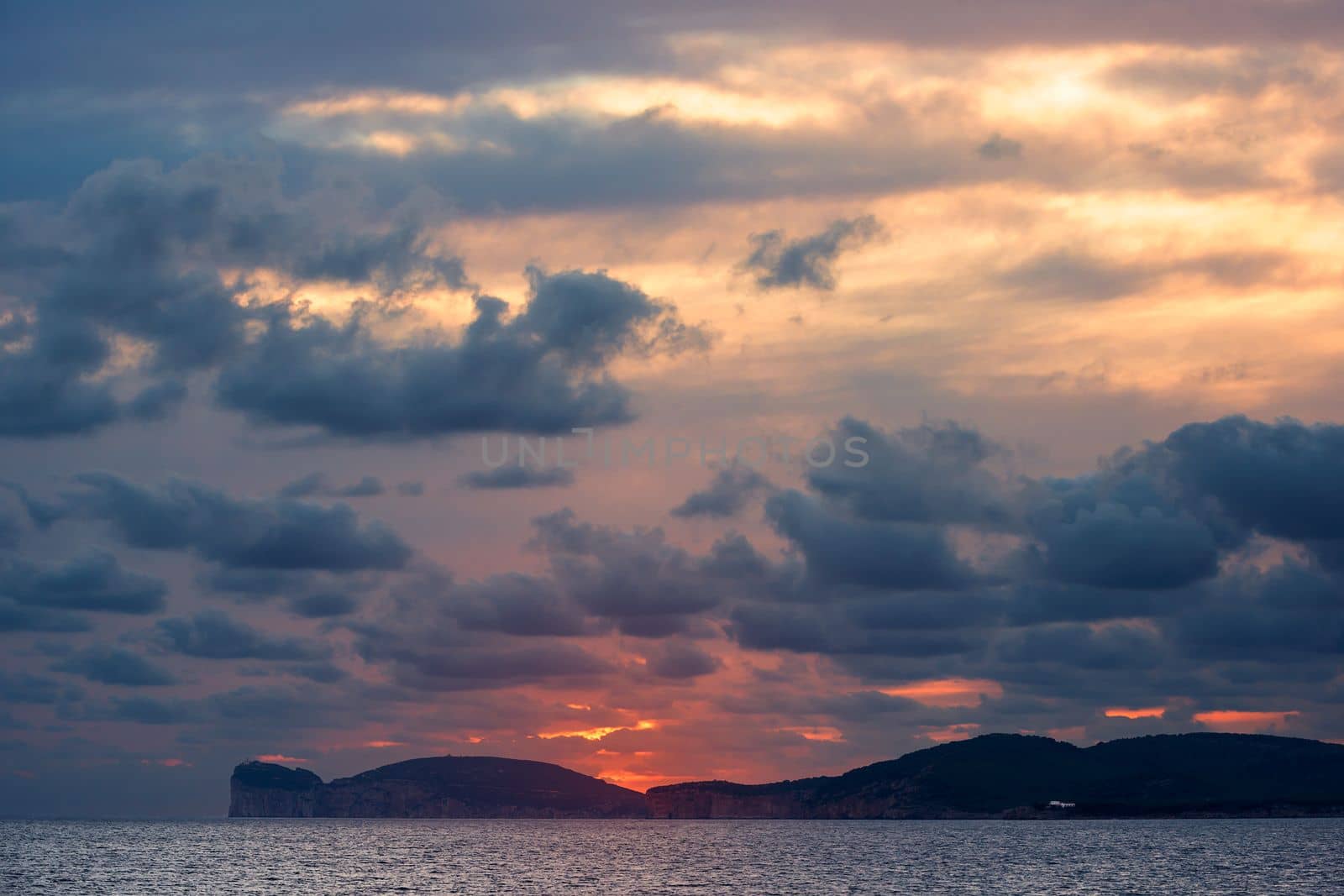 spectacular sunset on the giant that sleeps in Alghero, Sardinia, Italy