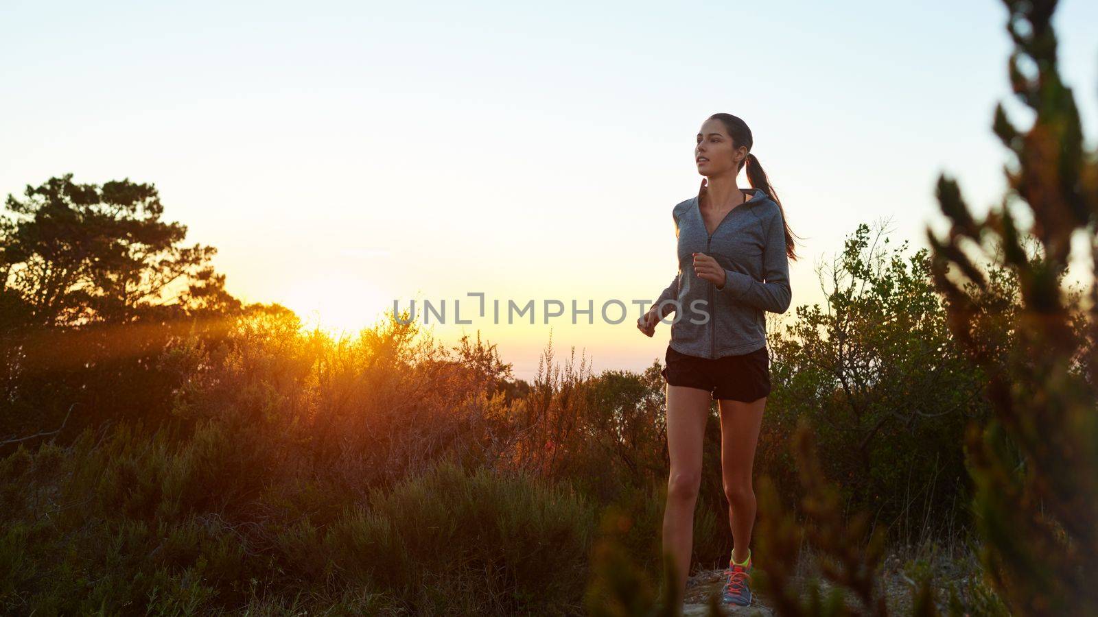 Fitness is a lifestyle with no finish line. a young woman jogging outdoors