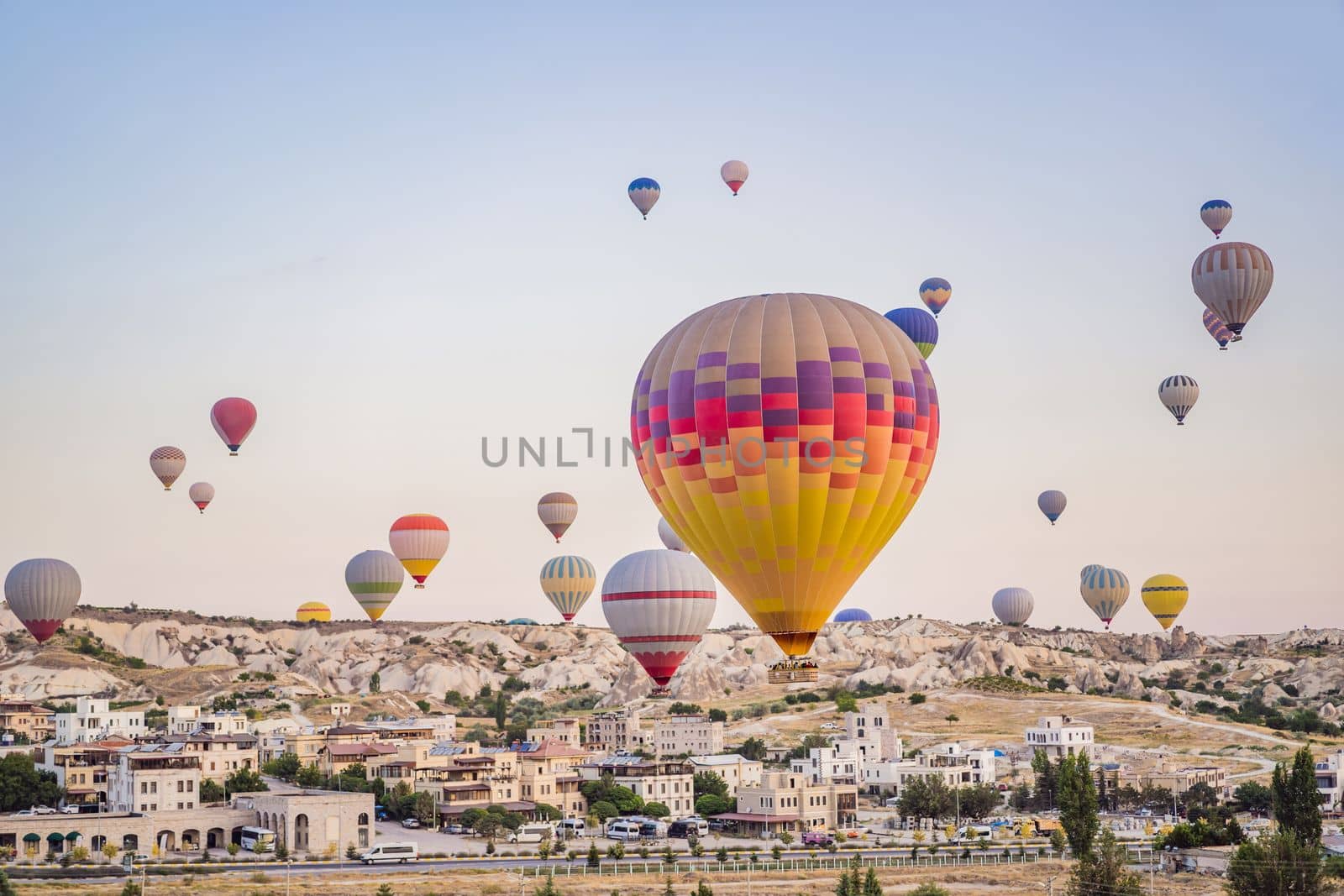 Colorful hot air balloon flying over Cappadocia, Turkey by galitskaya