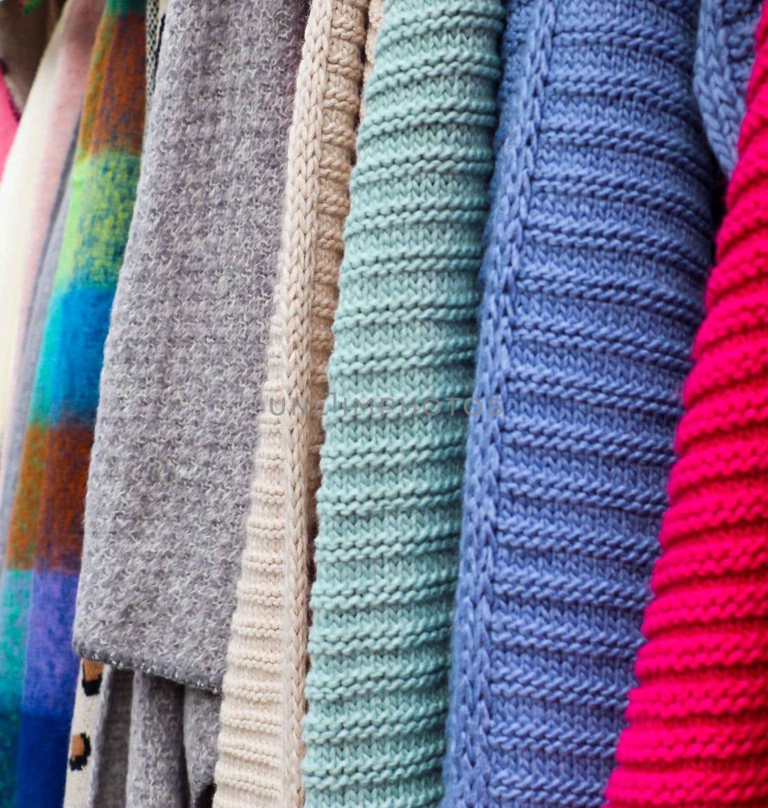 Samples of cloth and fabrics in different colors found at a fabrics market.