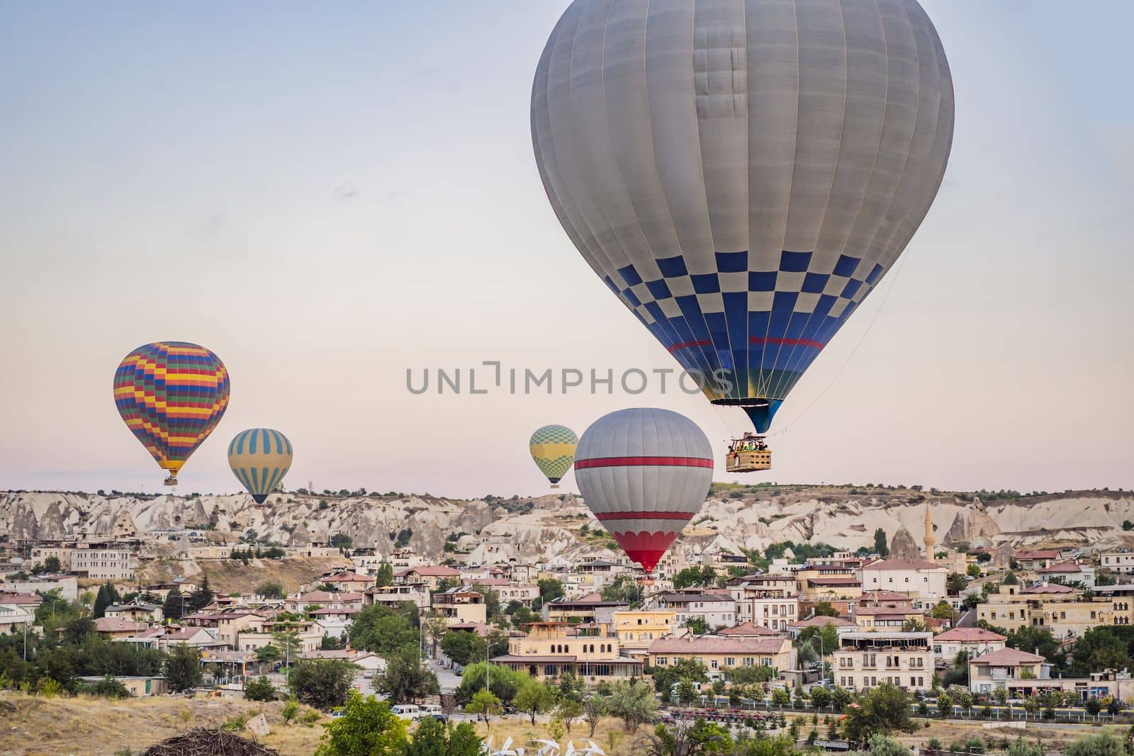 Colorful hot air balloon flying over Cappadocia, Turkey by galitskaya