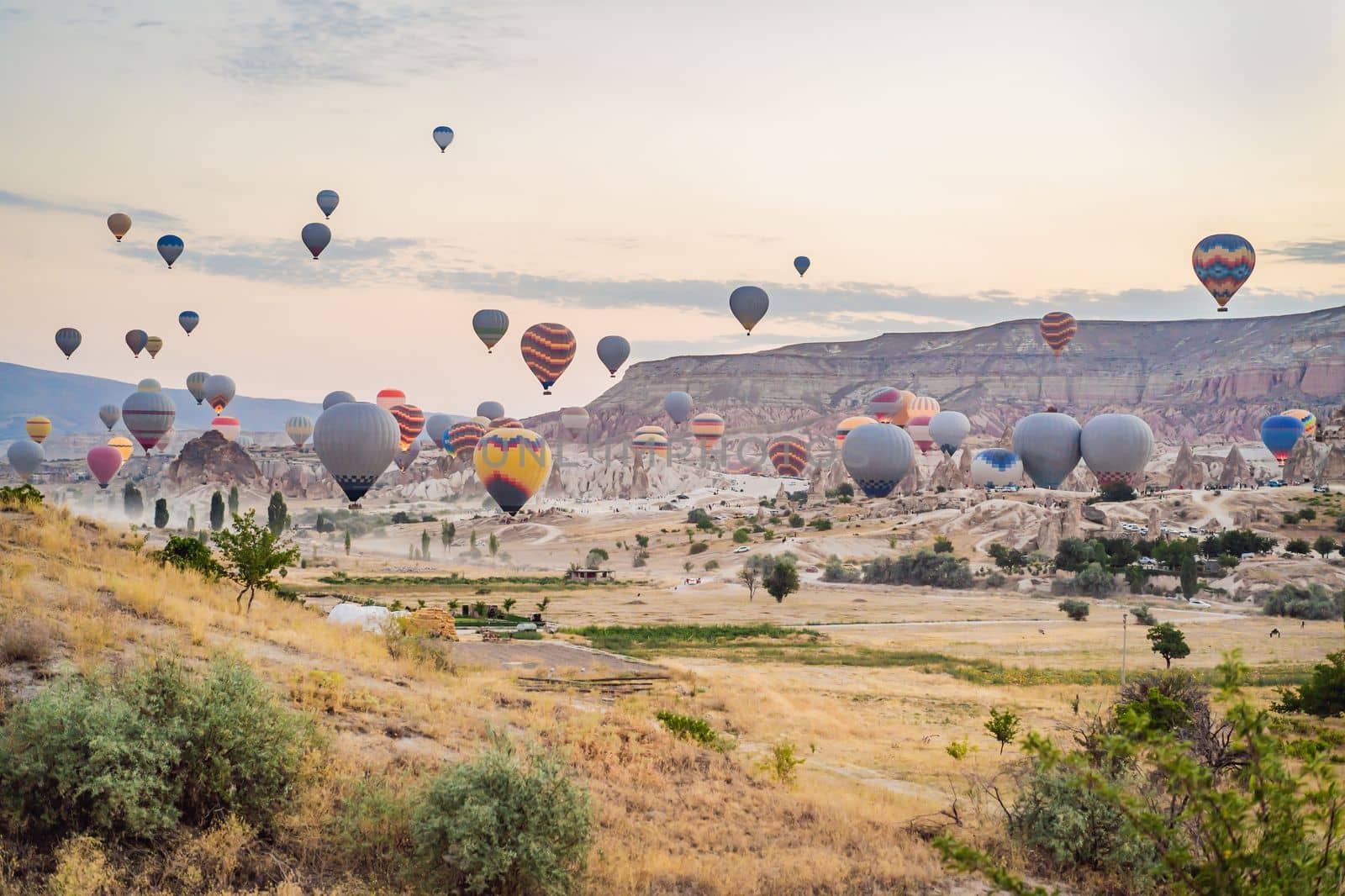 Colorful hot air balloon flying over Cappadocia, Turkey by galitskaya