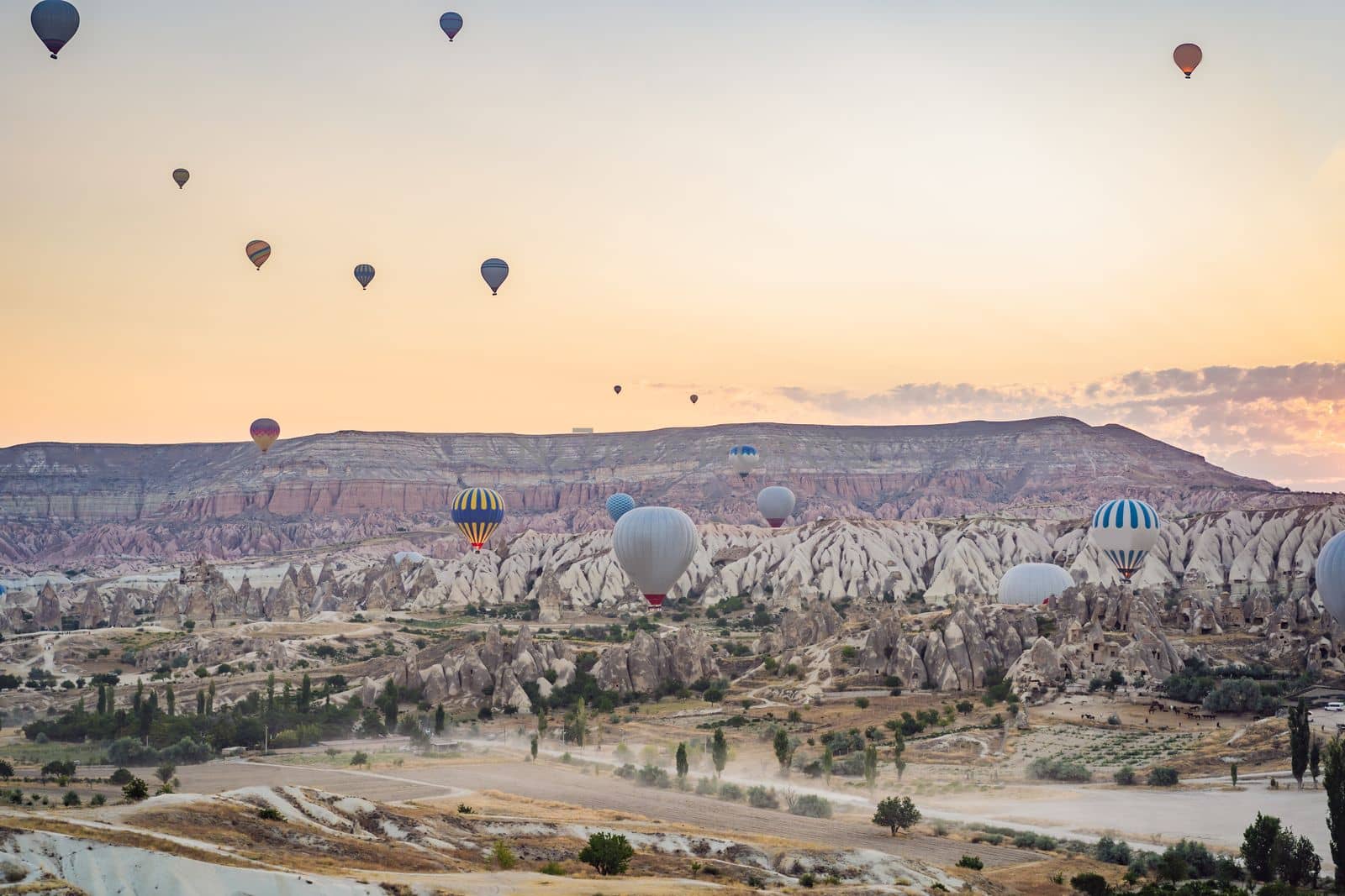 Colorful hot air balloon flying over Cappadocia, Turkey by galitskaya