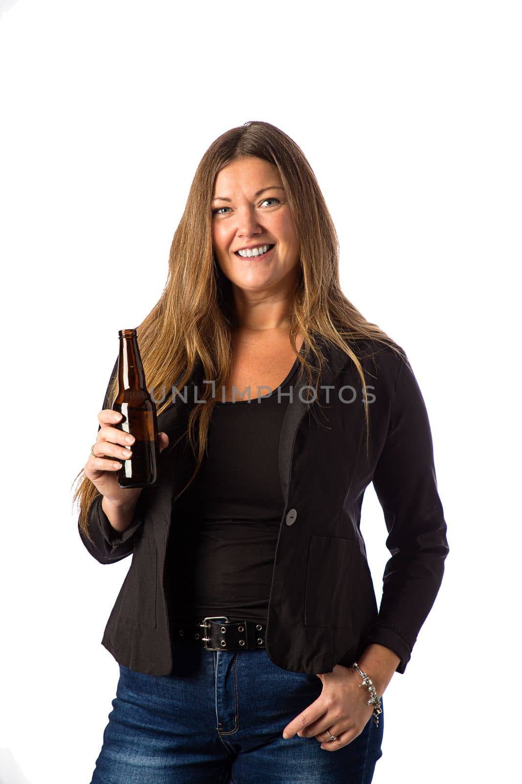 Isolated portrait of a forty year old woman in a sport coat holding a brown beer bottle