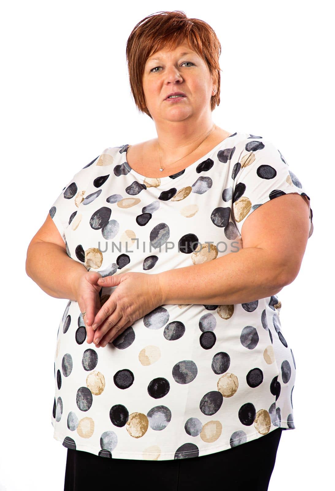 Isolated portrait of a fifty year old overweight red hair woman
