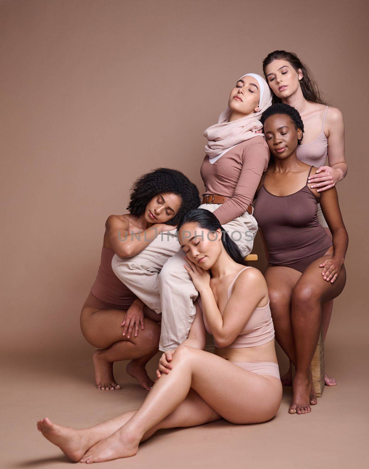 Diversity, woman and body positive skincare beauty for inclusion, spa dermatology wellness and natural body care in studio. Interracial model friends, support and relax cosmetic equality in underwear by YuriArcurs