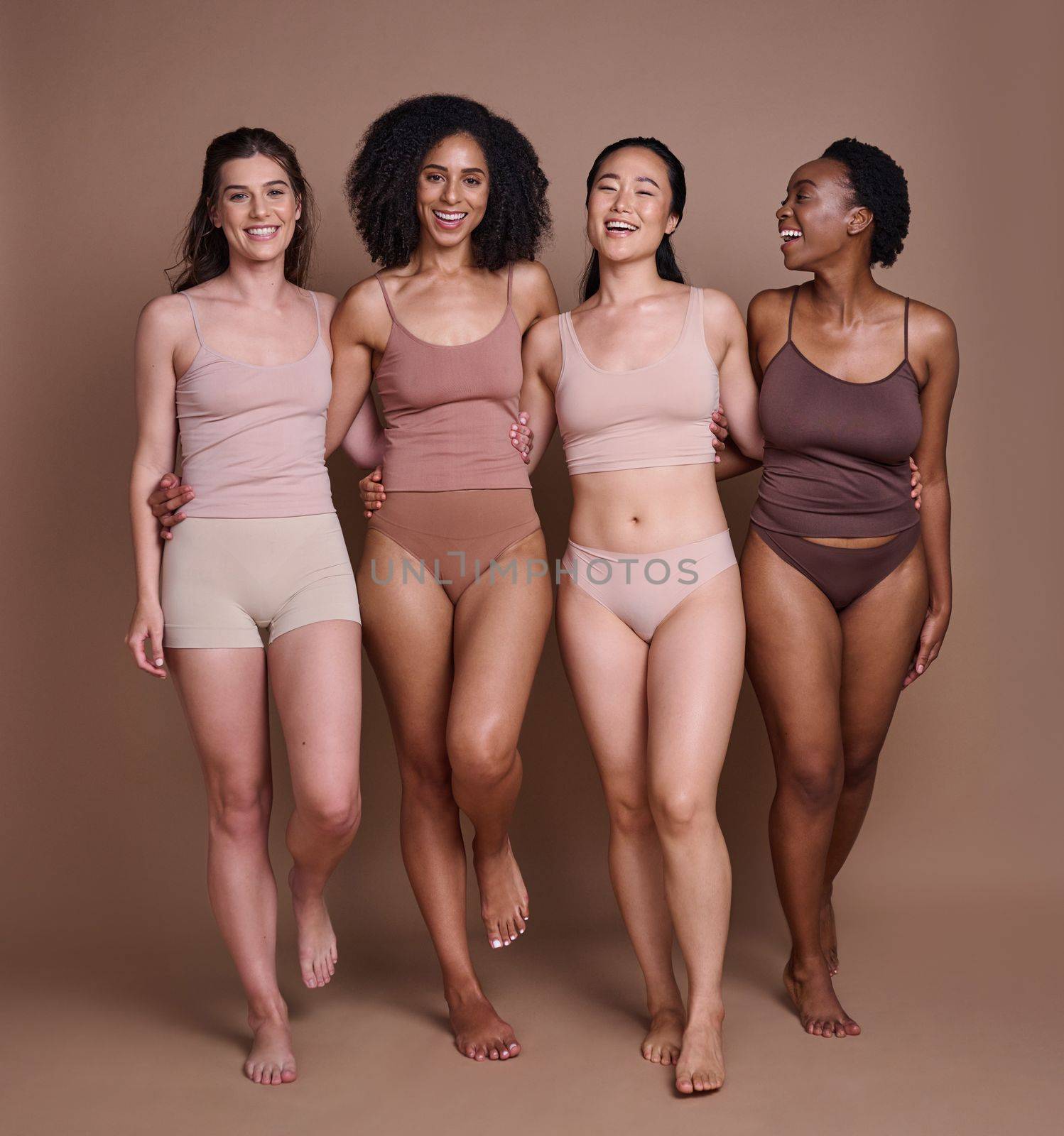 Diversity, woman and happy portrait in underwear for body motivation, beauty support and friendship collaboration. Interracial models, luxury skincare wellness and body positive happiness in studio.