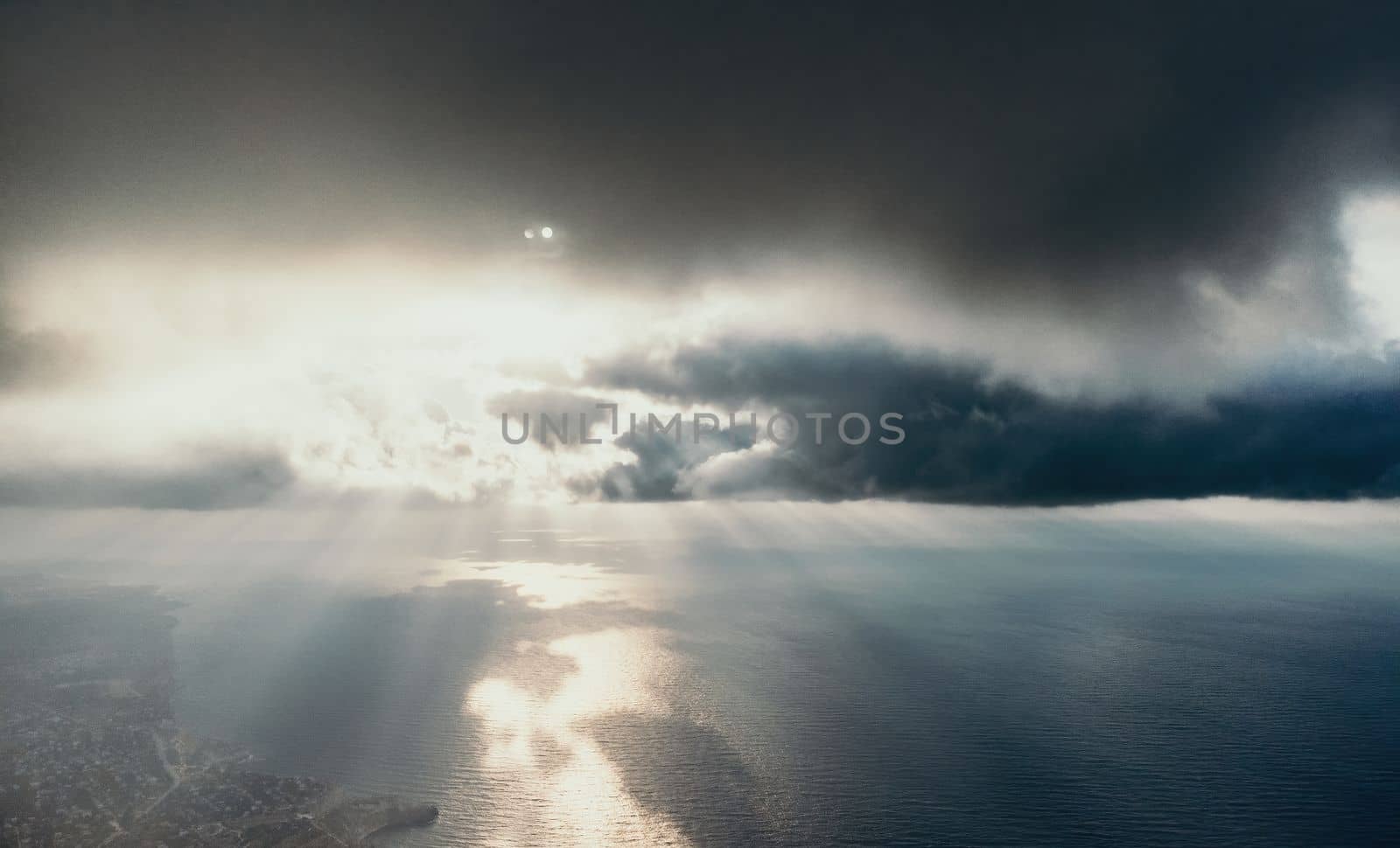 Blue sky with white clouds over calm summer panorama of the sea. Drone aerial view. Abstract aerial nature summer ocean sunset sea and sky background. Horizon. No people. Holiday and vacation concept