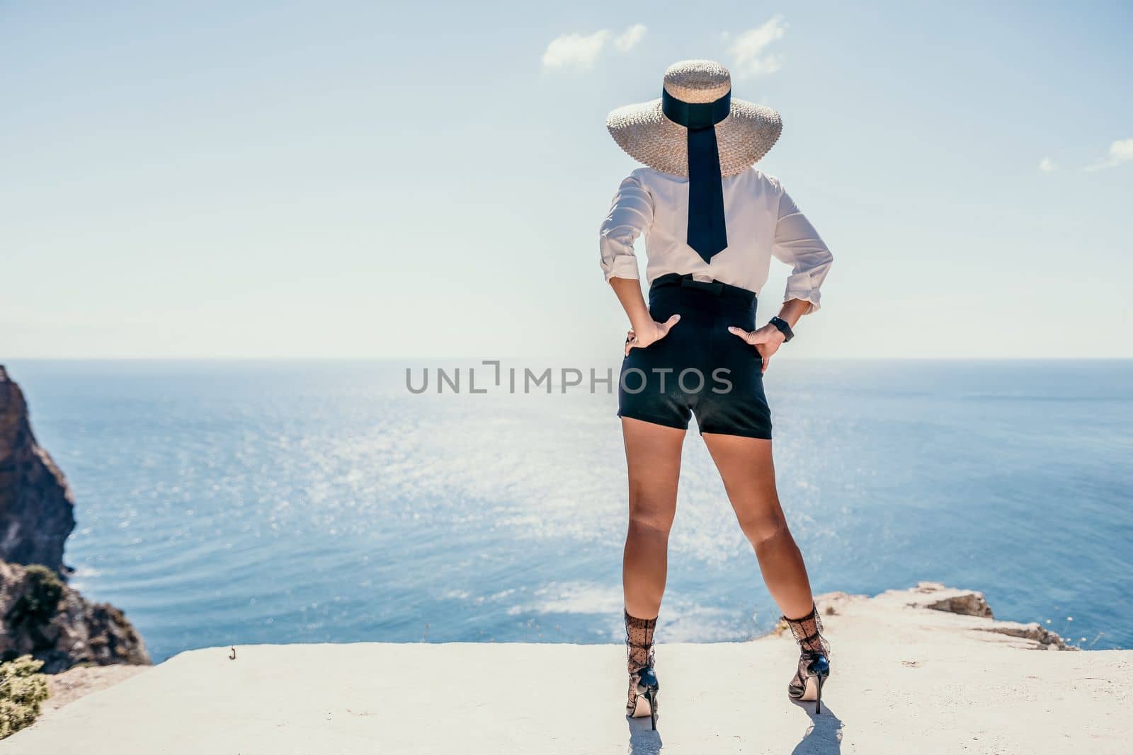 Happy girl doing yoga with laptop working at the beach. beautiful and calm business woman sitting with a laptop in a summer cafe in the lotus position meditating and relaxing. freelance girl remote work beach paradise