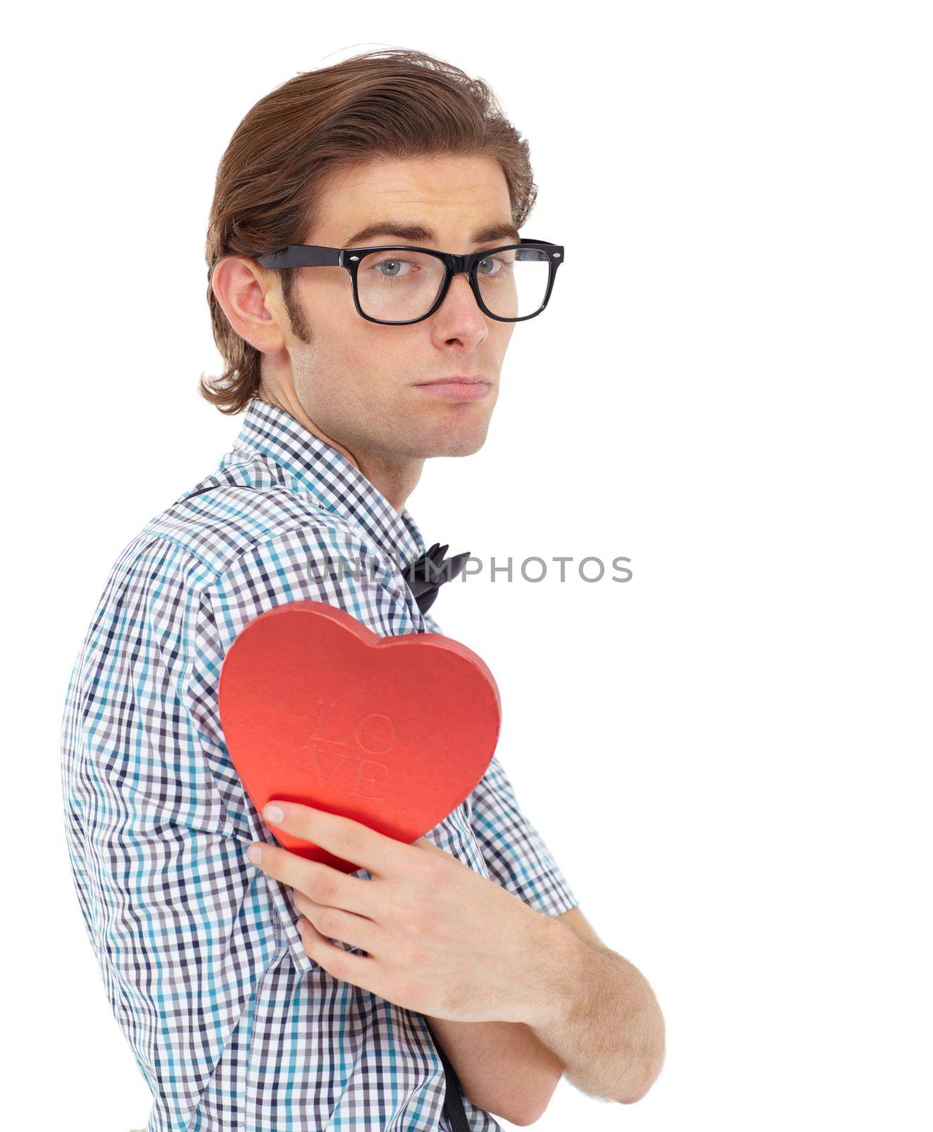 Love, depression and portrait of man with heart emoji, romance and valentines day isolated on white background. Waiting, sad geek and valentine shape chocolate box with glasses and bow tie in studio
