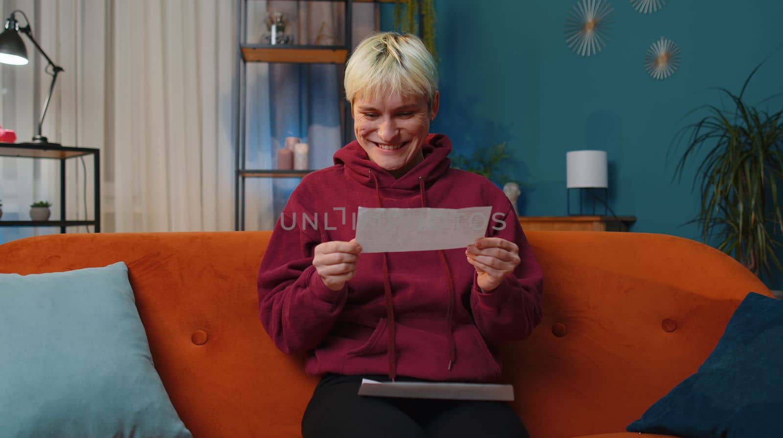 Happy woman open envelope letter, reading it. Career growth advance promotion, bank loan approve, successful admission to university monetary award long-awaited invitation great news, lottery game win