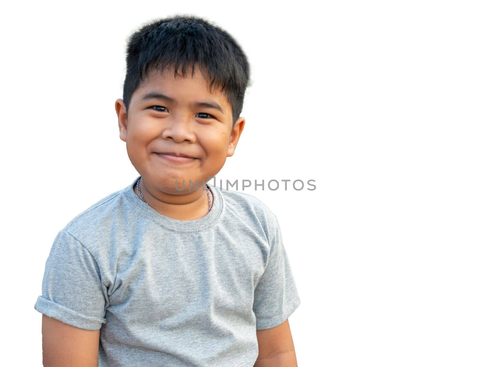 Portrait of smiling boy isolated on white background by Unimages2527