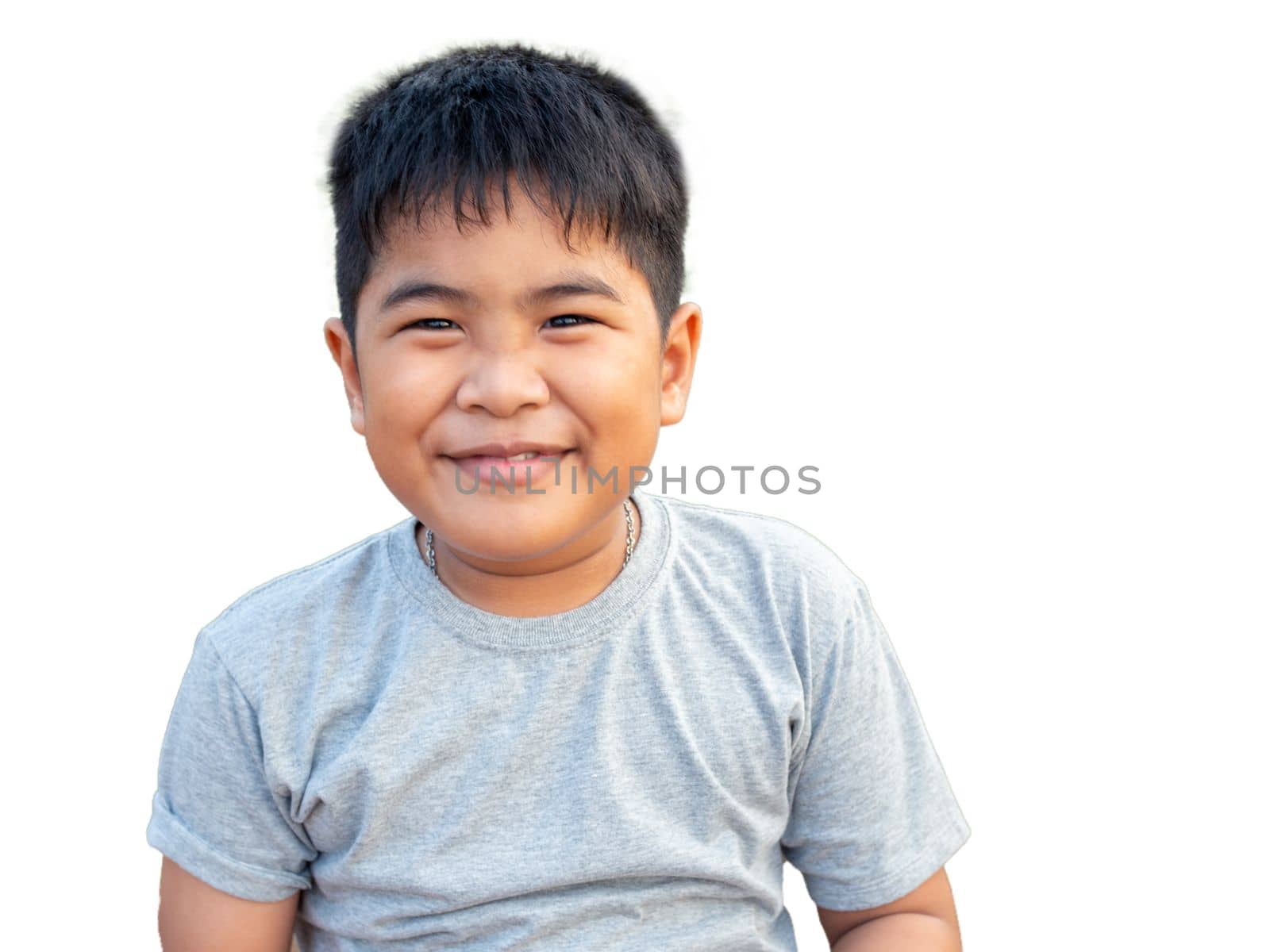 Portrait of smiling boy isolated on white background by Unimages2527