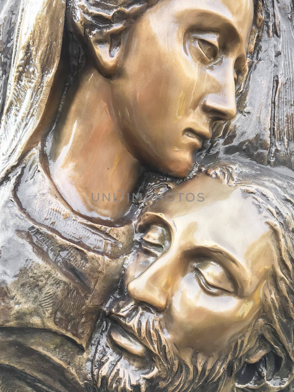 Jesus and Mary. Bronze statue of Mother Mary holding her son Jesus.