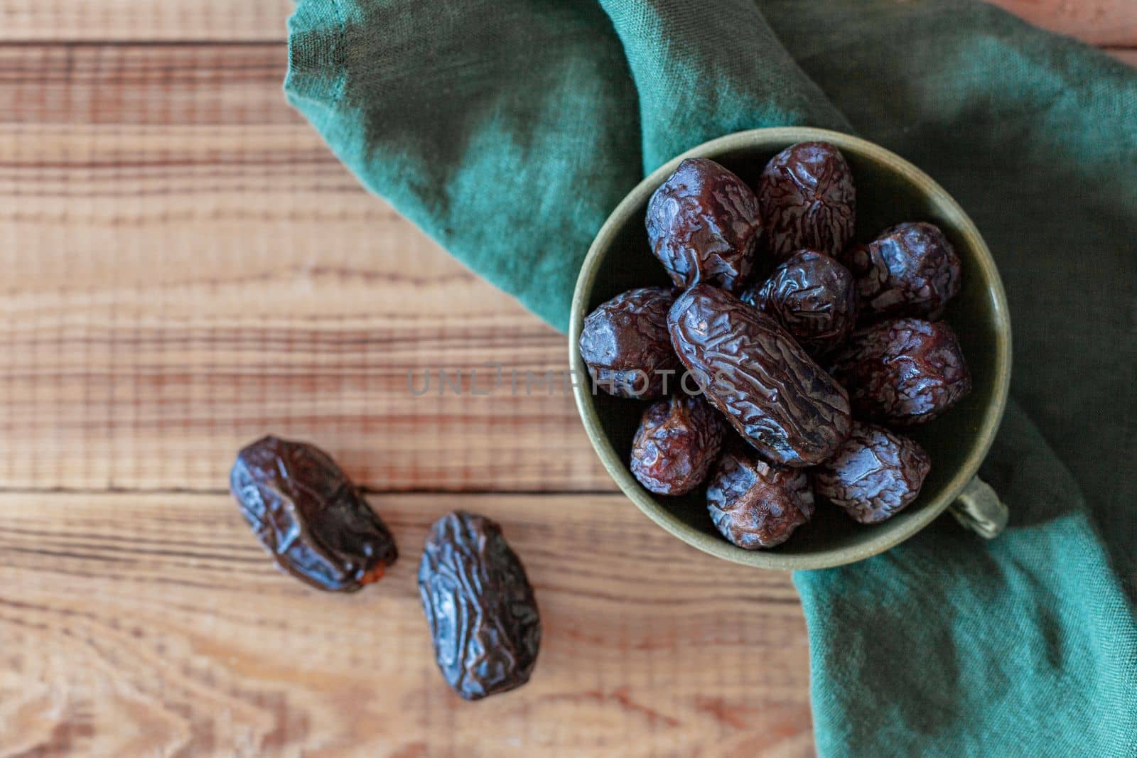 dates fruits in a bowl, top view, copy space