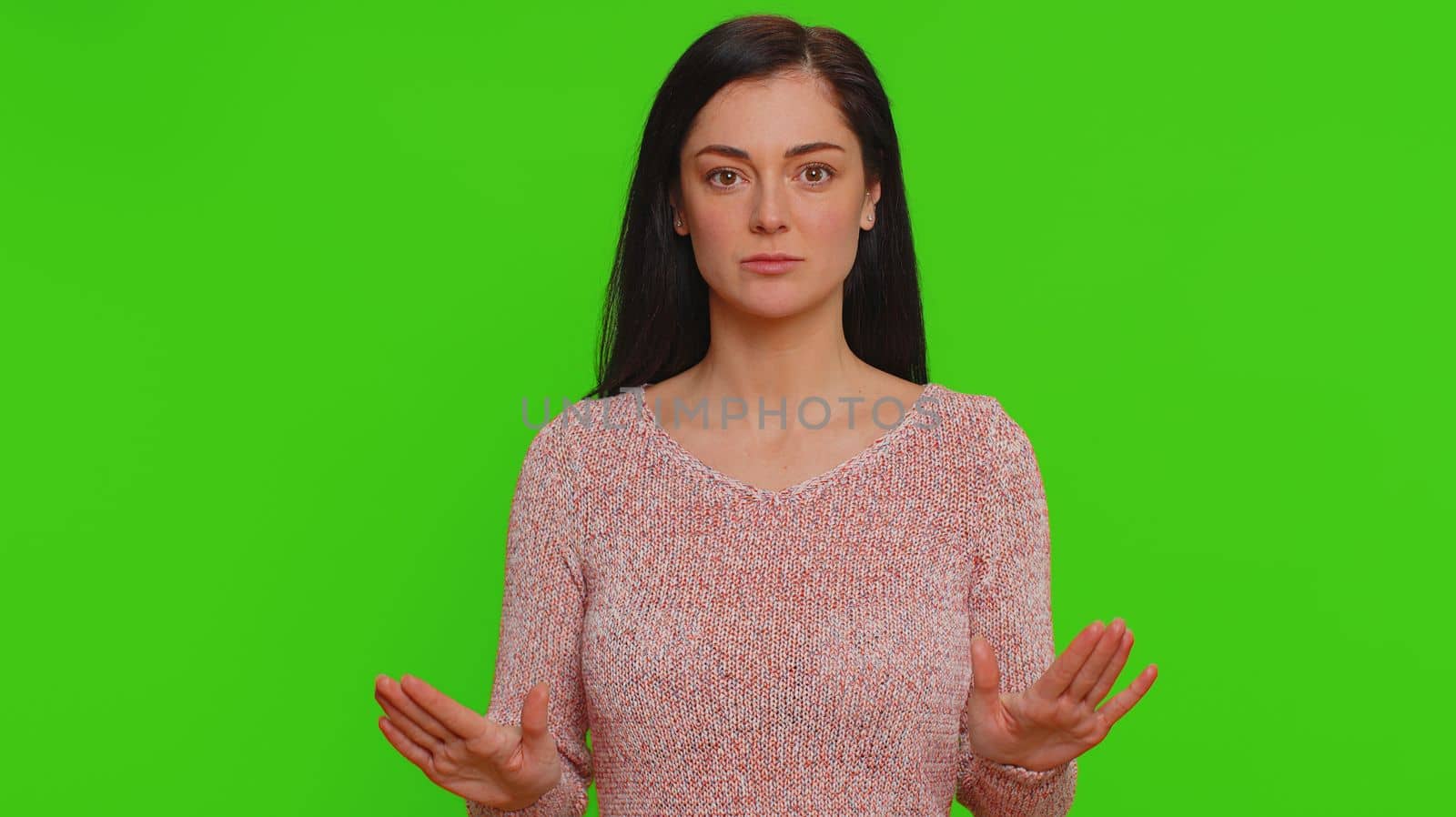 Hey you, be careful. Young woman warning with admonishing finger gesture, saying no, be careful, scolding and giving advice to avoid danger, disapproval sign. Girl isolated on chroma key background