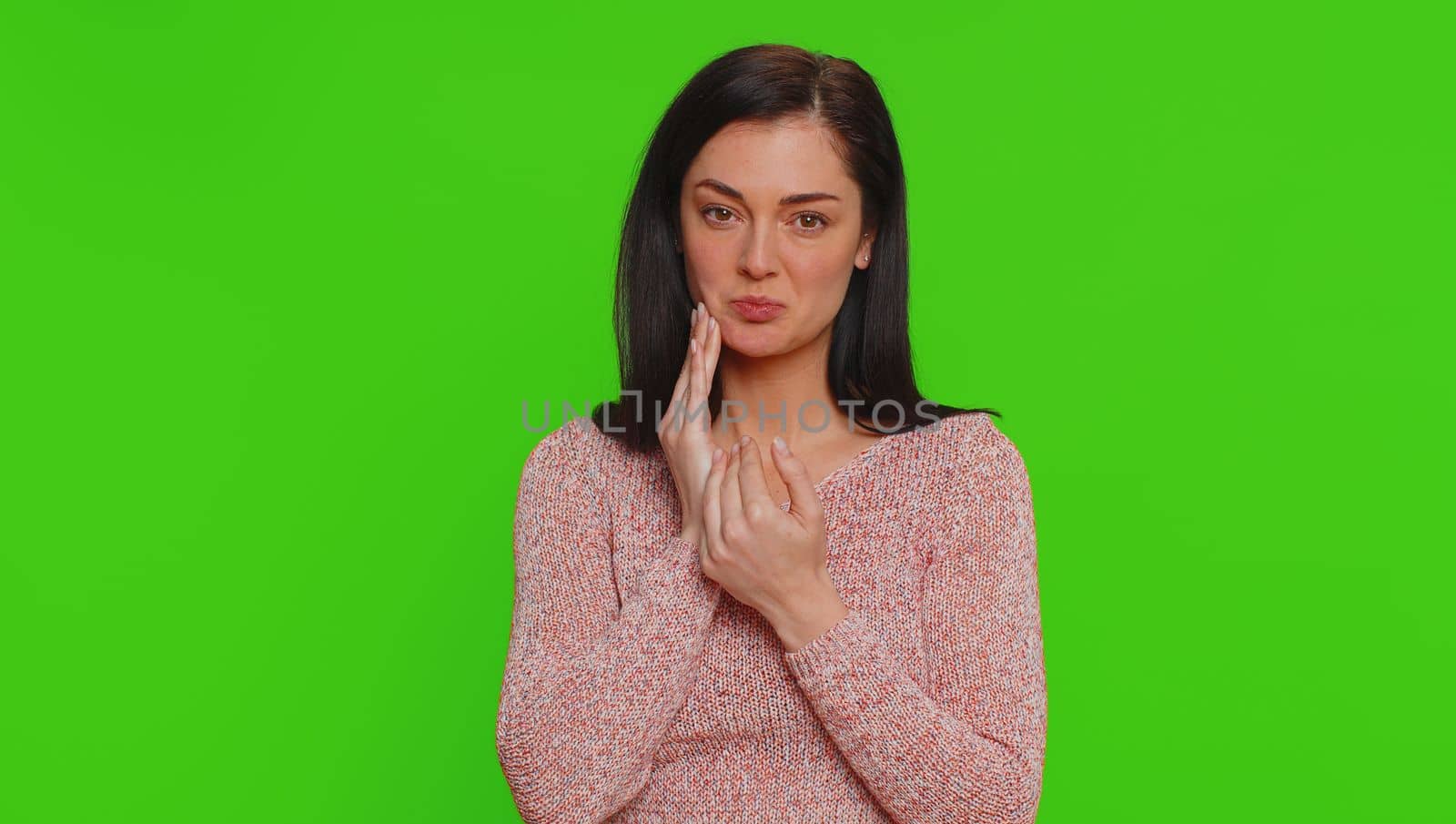 Hipster pretty woman touching sore cheek suffering from toothache cavities or gingivitis waiting for dentist appointment gums disease. Young girl indoor studio shot isolated on chroma key background