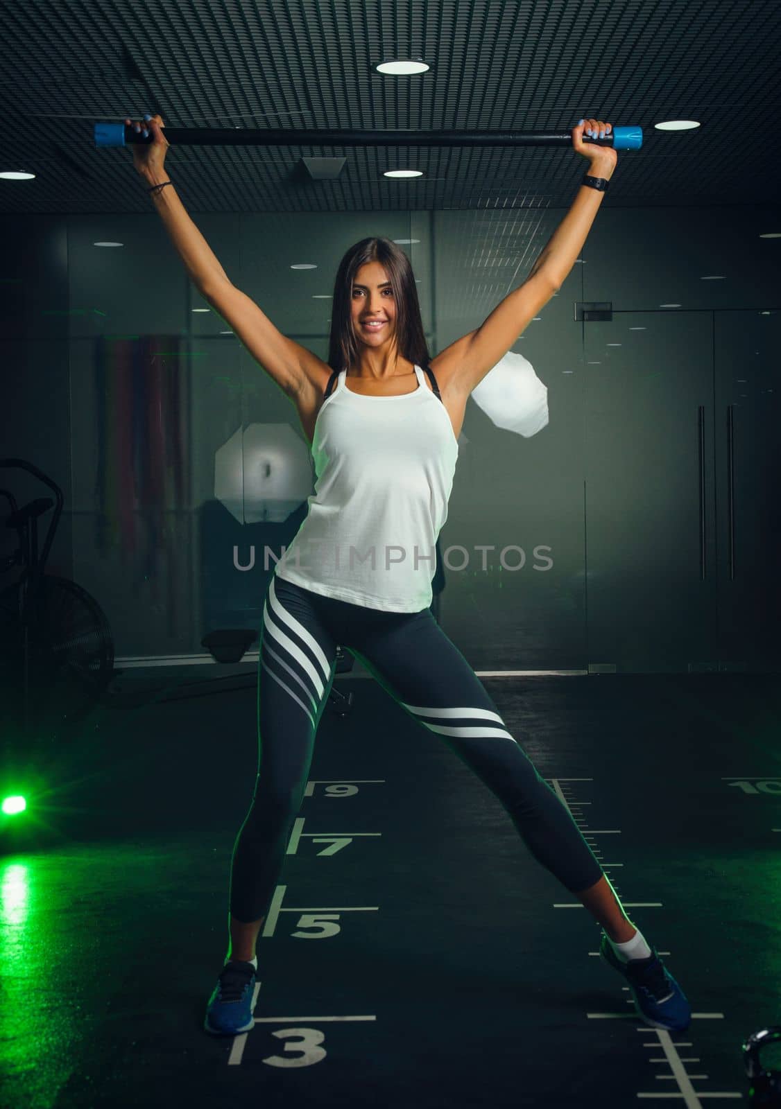 sexy girl in a fitness club in a cool sports uniform