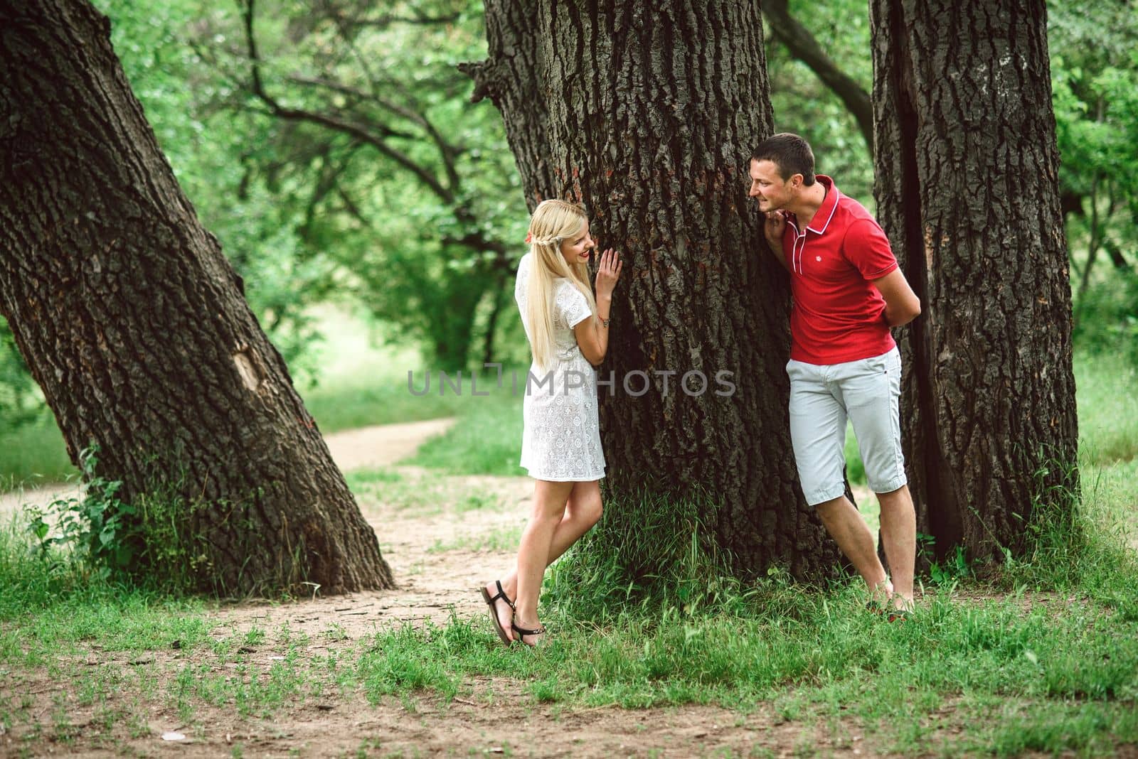 couple in love at a picnic in a park with green grass by Andreua