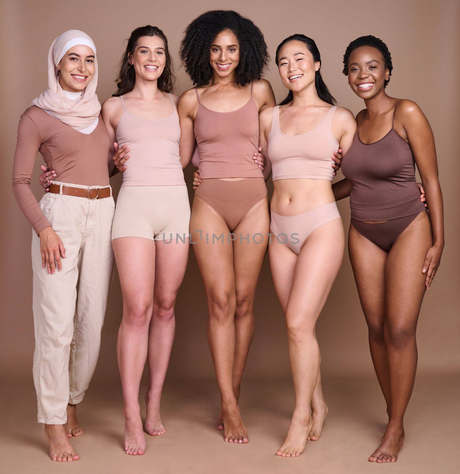 Women, studio beauty and diversity in global community, support and self love, wellness and healthy skincare. Portrait, female group and models for body positive, solidarity and international culture by YuriArcurs