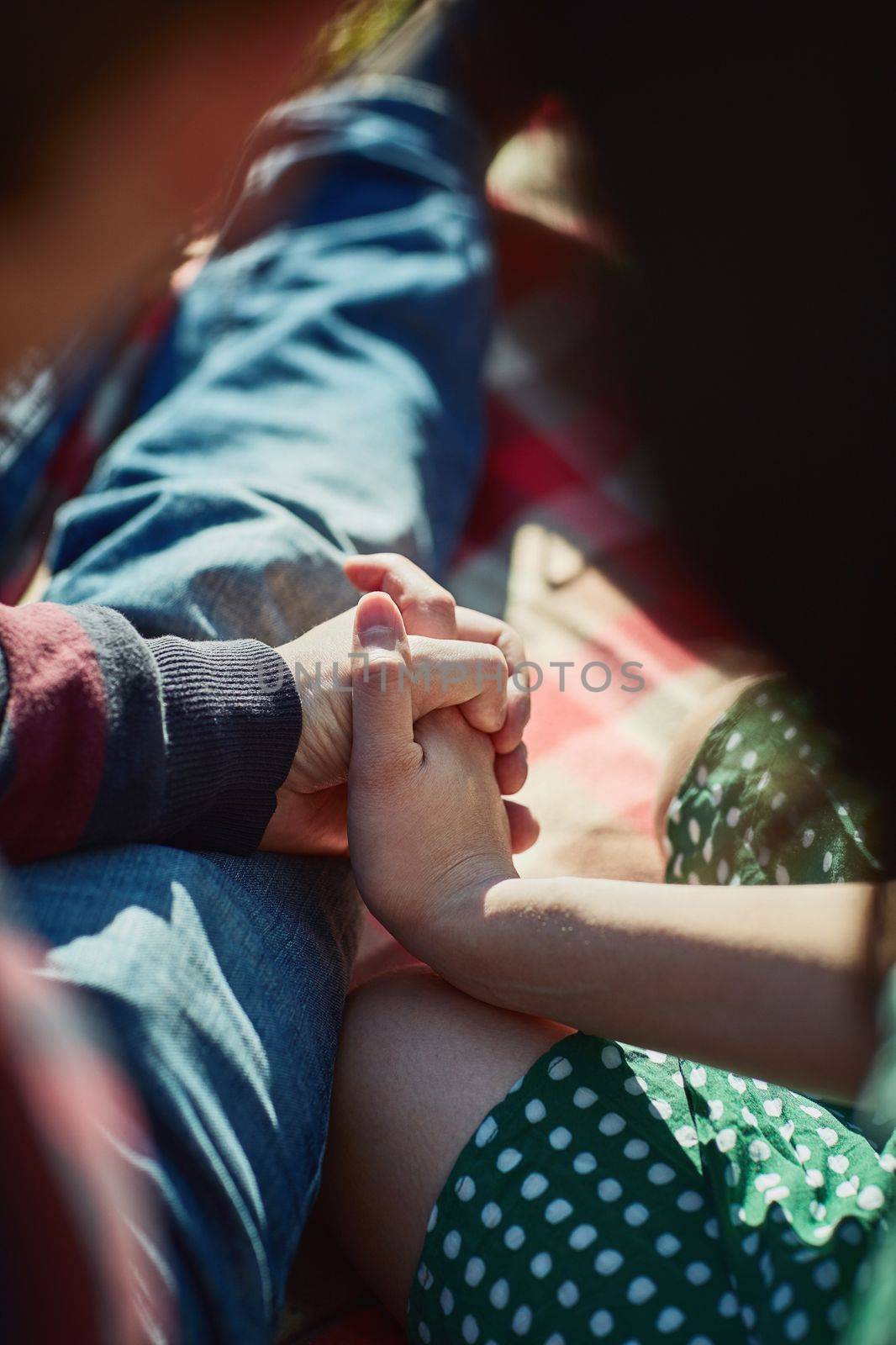 My heart chooses you over and over again. an affectionate couple holding hands outdoors