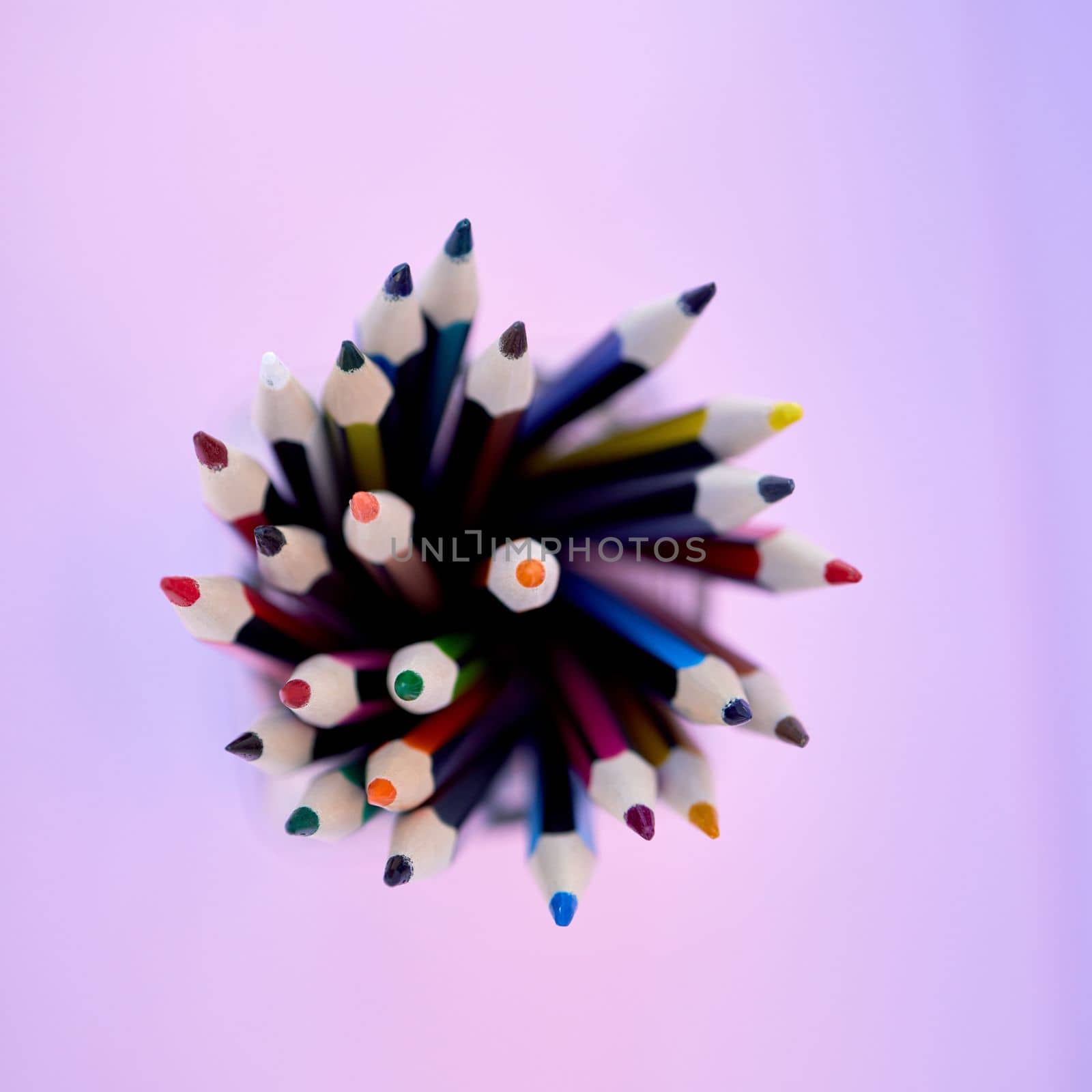 Pencil, color and stationery with top view, school or art supplies zoom for drawing with education and creative. Writing tools, creativity mockup and colorful close up against studio background.