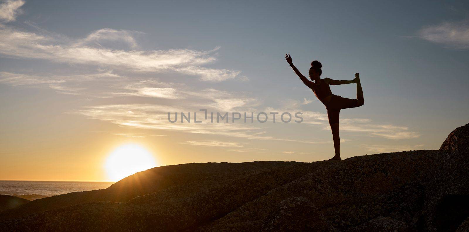 Woman, silhouette or yoga on sunset beach rocks in relax fitness, training and exercise for mental health, body mobility or wellness. Yogi, pilates or workout at sunrise for zen stretching by ocean.