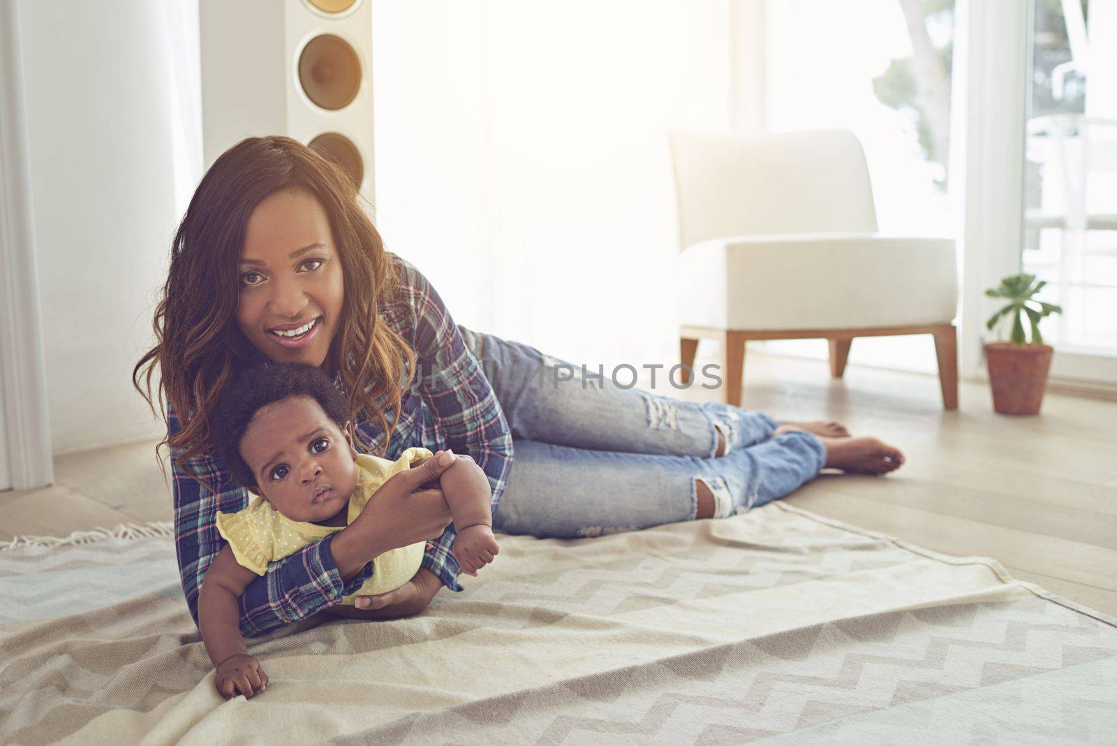 She means the world to me. Full length shot of a young mother and her little baby girl at home