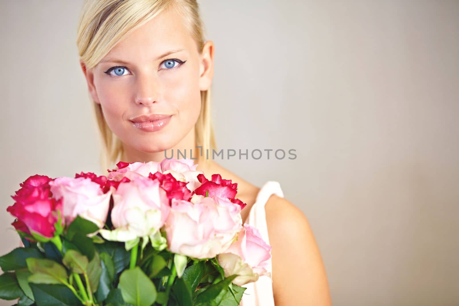 Portrait, mockup and woman with bouquet roses, smile and gift for Valentines day, happiness and studio background. Face, female or lady with flowers, love and joyful with peace or romance on backdrop.