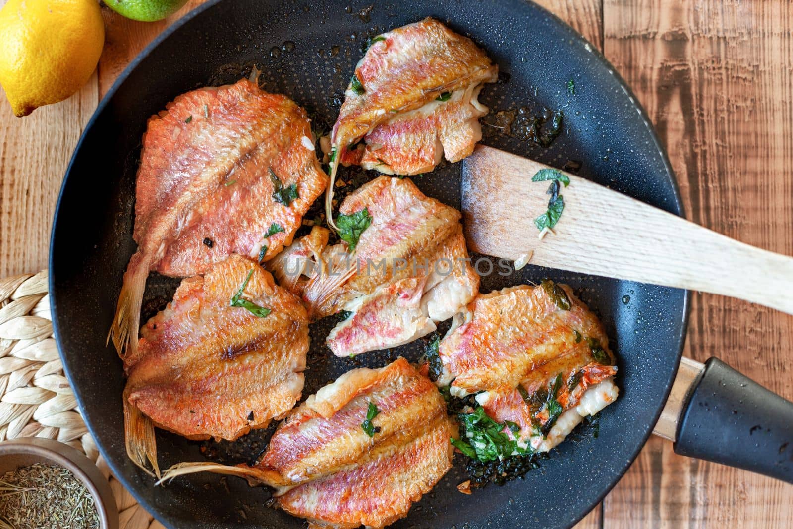 red mullet fish cooked on a pan, side view, top view