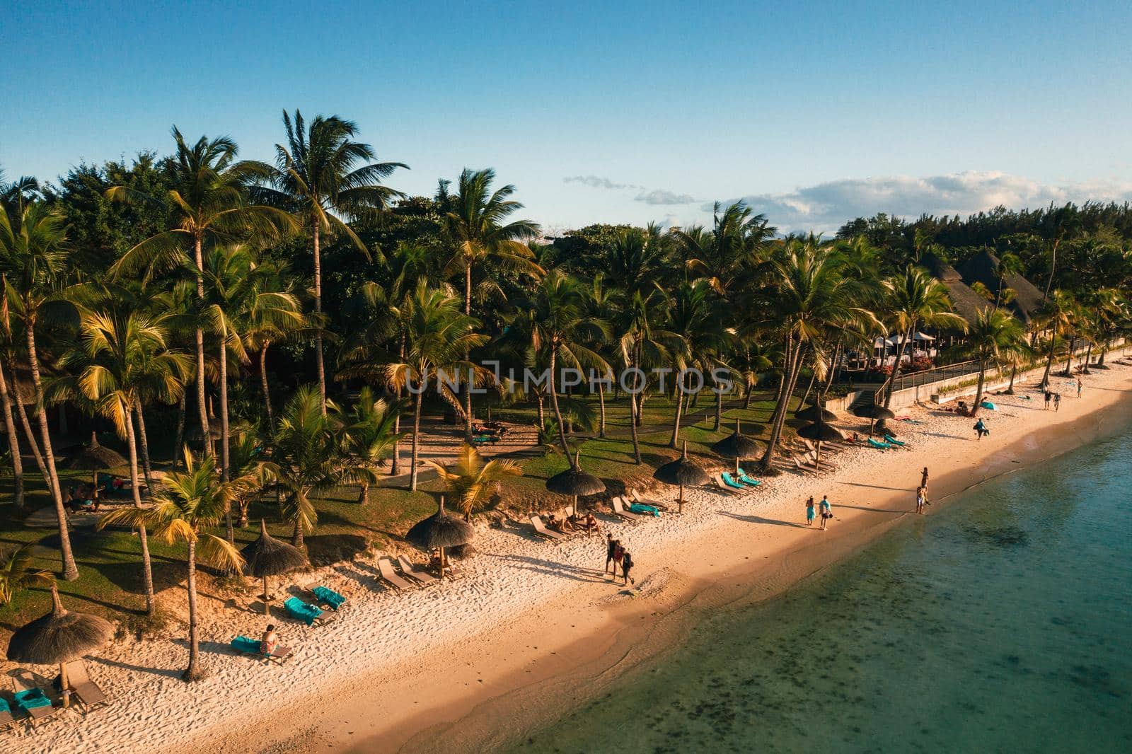 On the beautiful beach of the island of Mauritius along the coast. Shooting from a bird's eye view of the island of Mauritius. by Lobachad