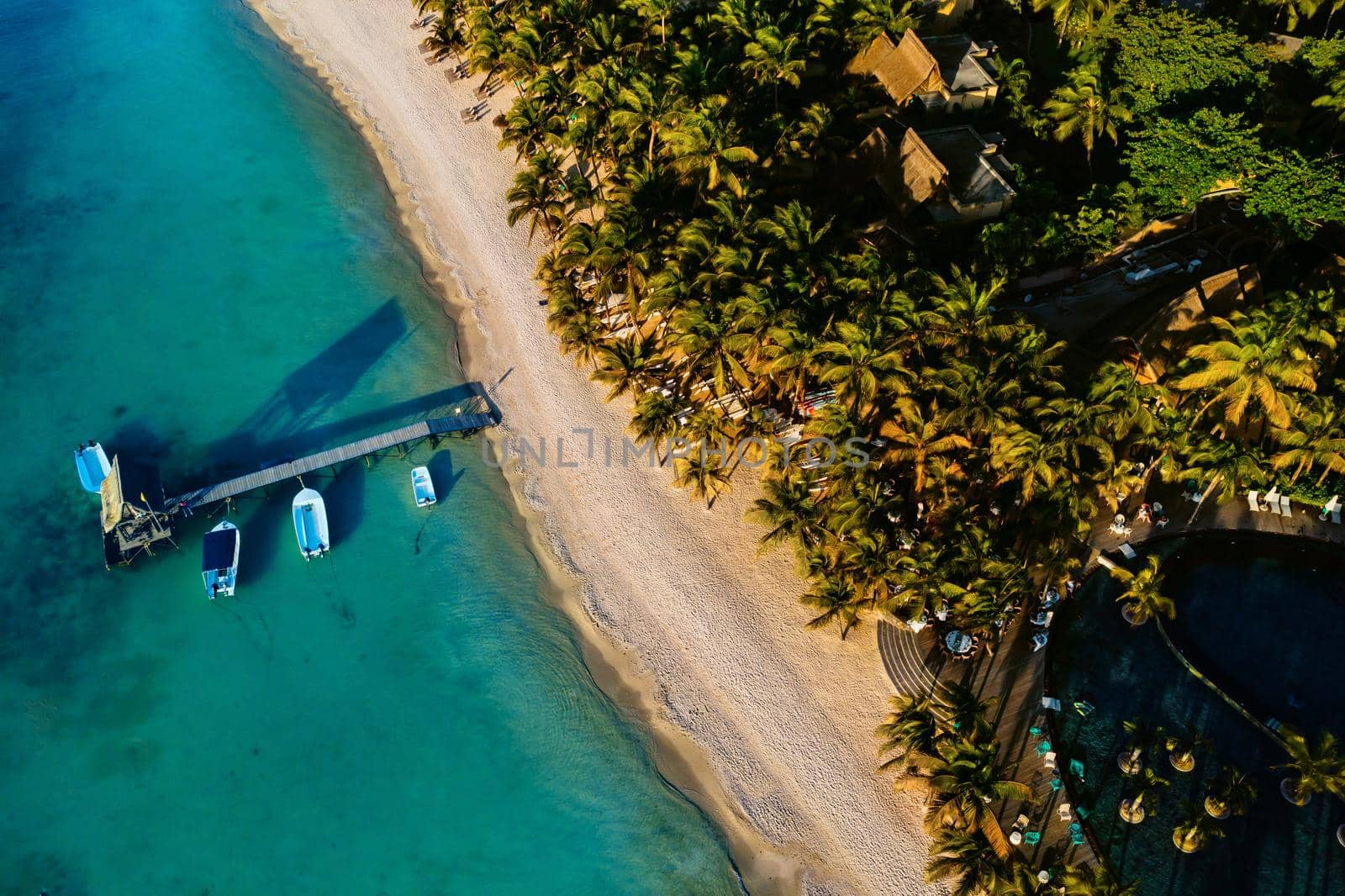 On the beautiful beach of the island of Mauritius along the coast. Shooting from a bird's eye view of the island of Mauritius