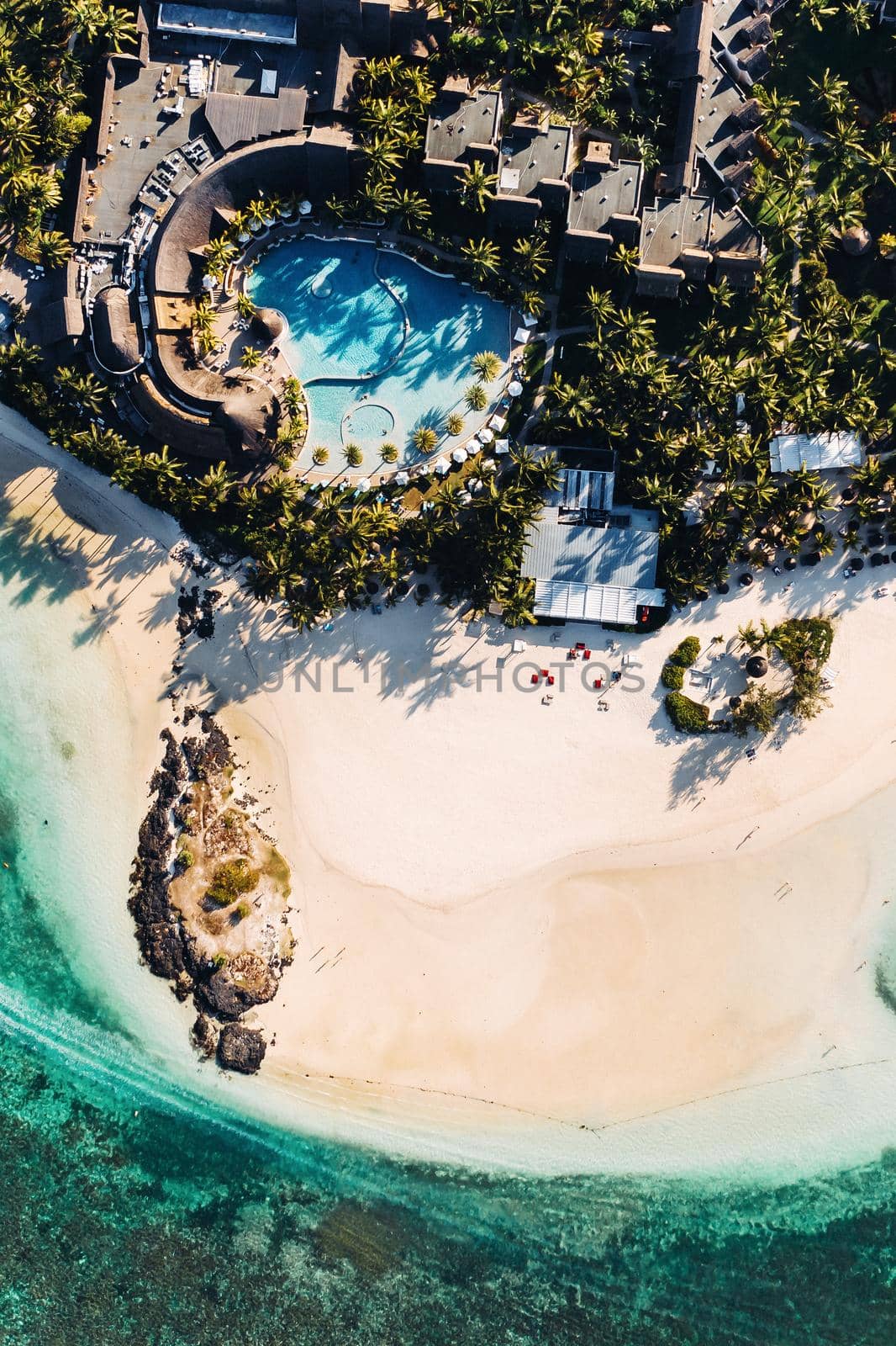 Aerial picture of the east coast of Mauritius Island. Flying above the turquoise lagoon of Mauritius in the region of Belle Mare. by Lobachad