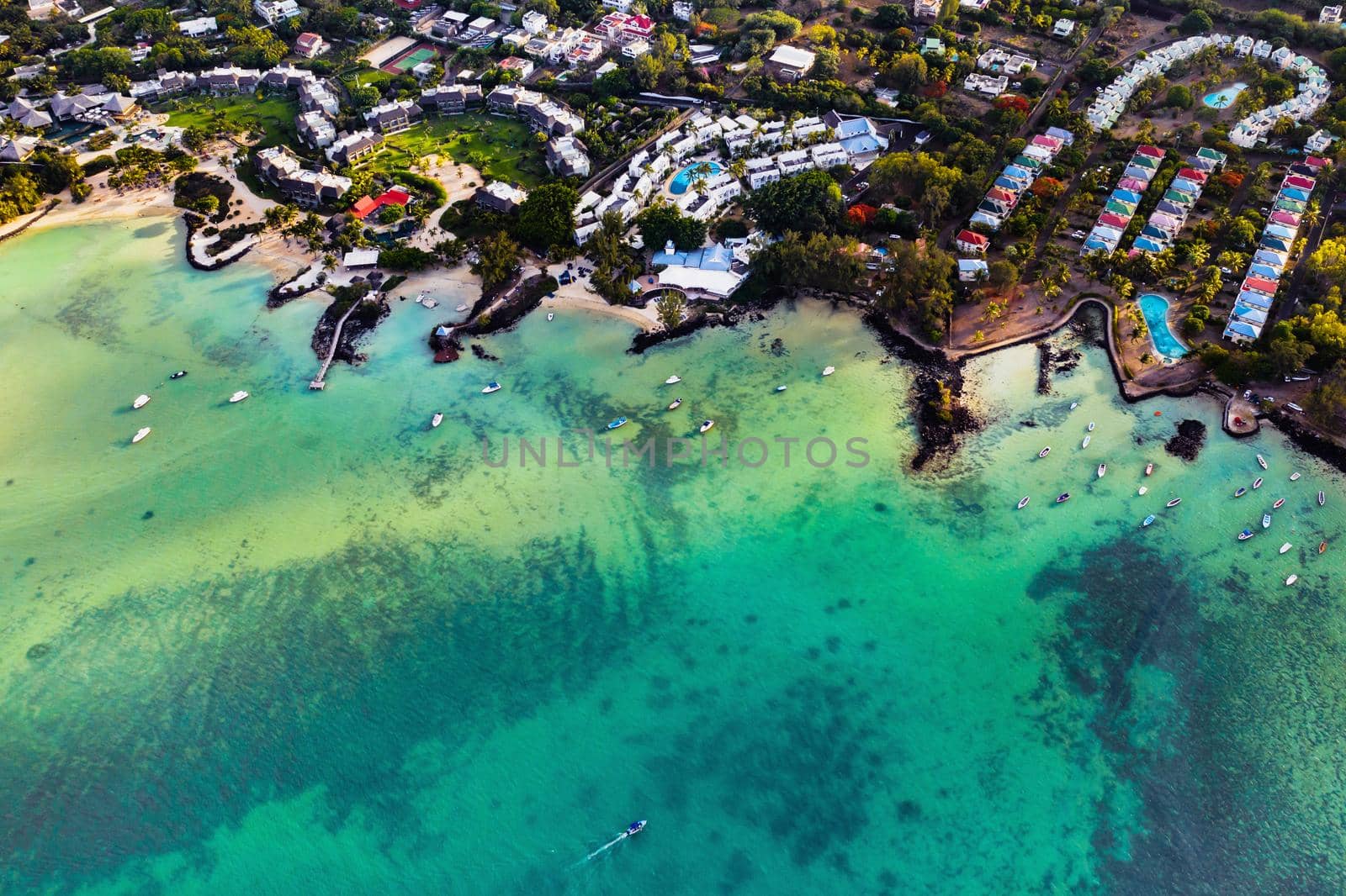 Aerial photography of a coral reef and a hotel complex with beaches in Mauritius, the North-East coast of the island of Mauritius. Beautiful lagoon of the island of Mauritius, taken from above