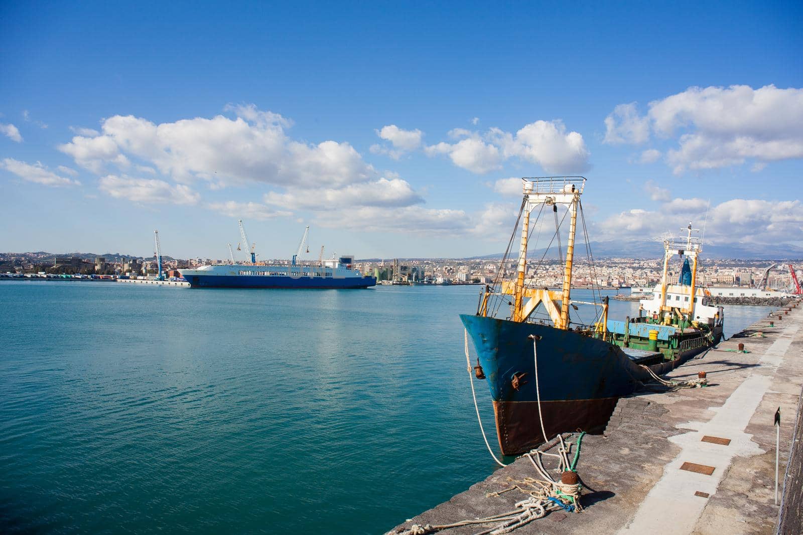 Old fisherboat docked in the Catania pier