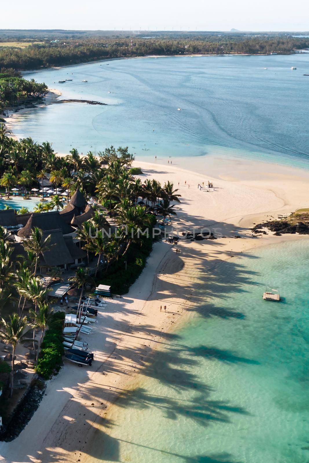 View from the height of the east coast of the island of Mauritius. Flying over the turquoise lagoon of the island of Mauritius in the area of Bel Mare. by Lobachad