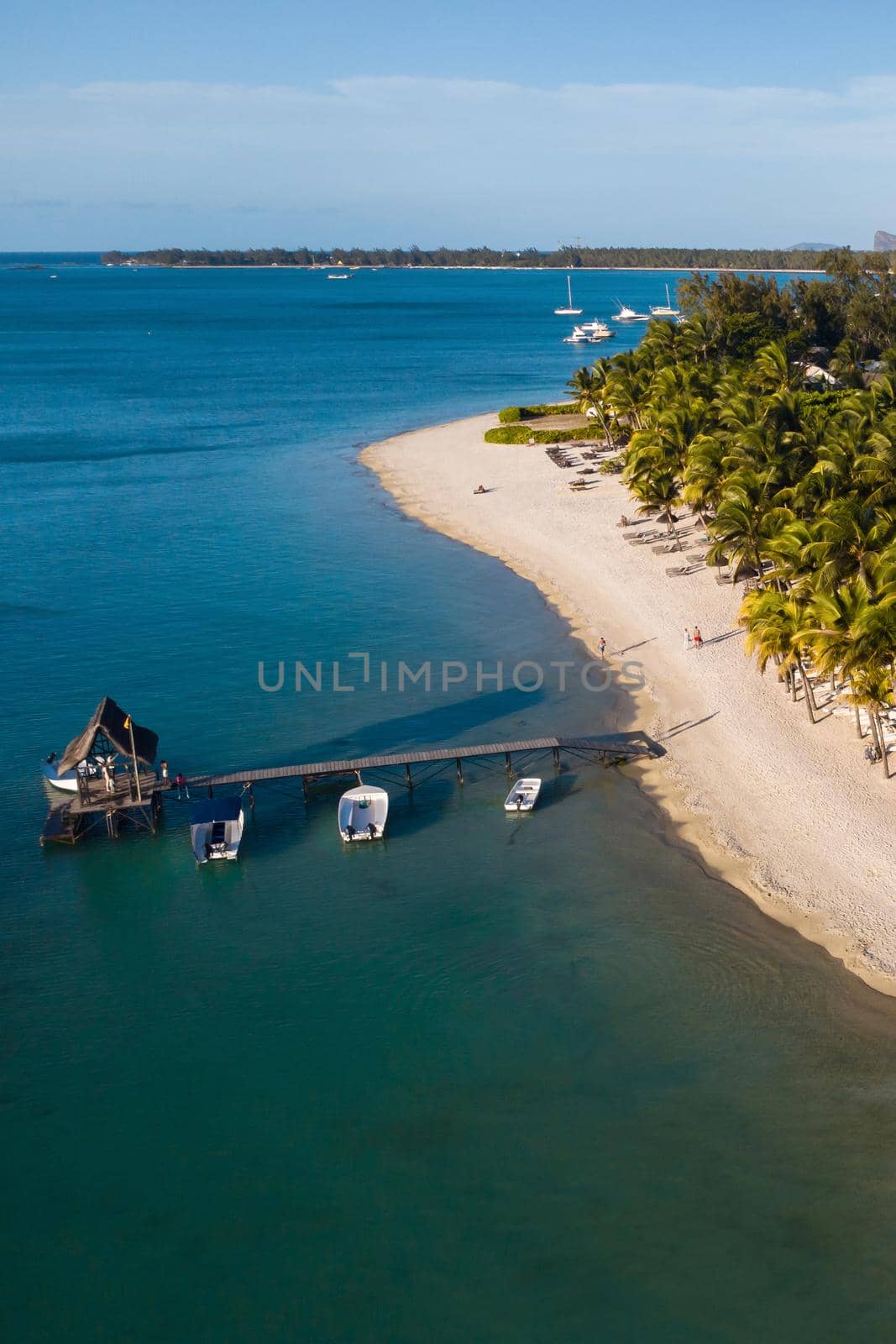 View from the height of the coast and the pier of the island of Mauritius in the Indian Ocean by Lobachad