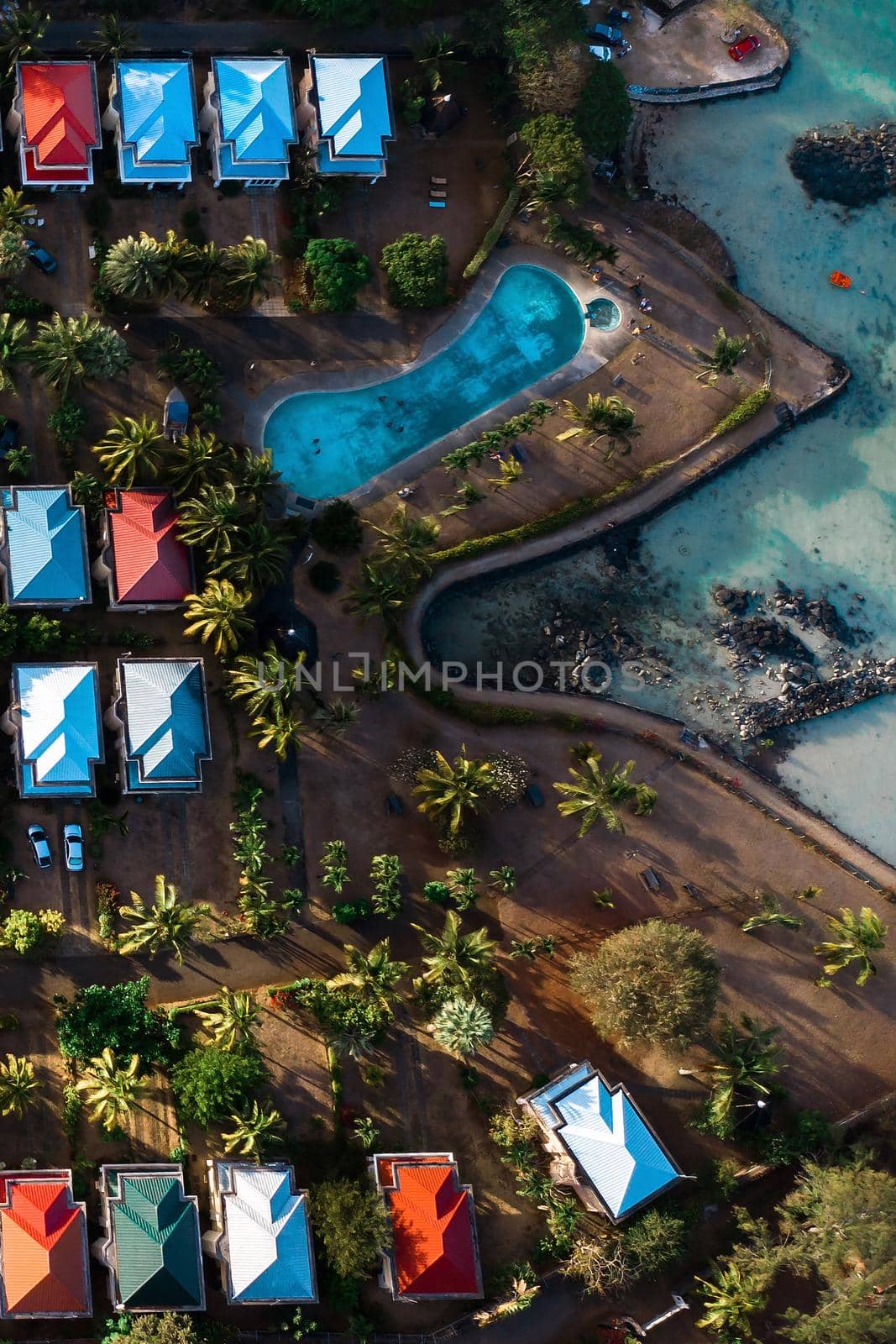 Aerial view of the cabins and pool from a bird's eye view on the island of Mauritius. by Lobachad