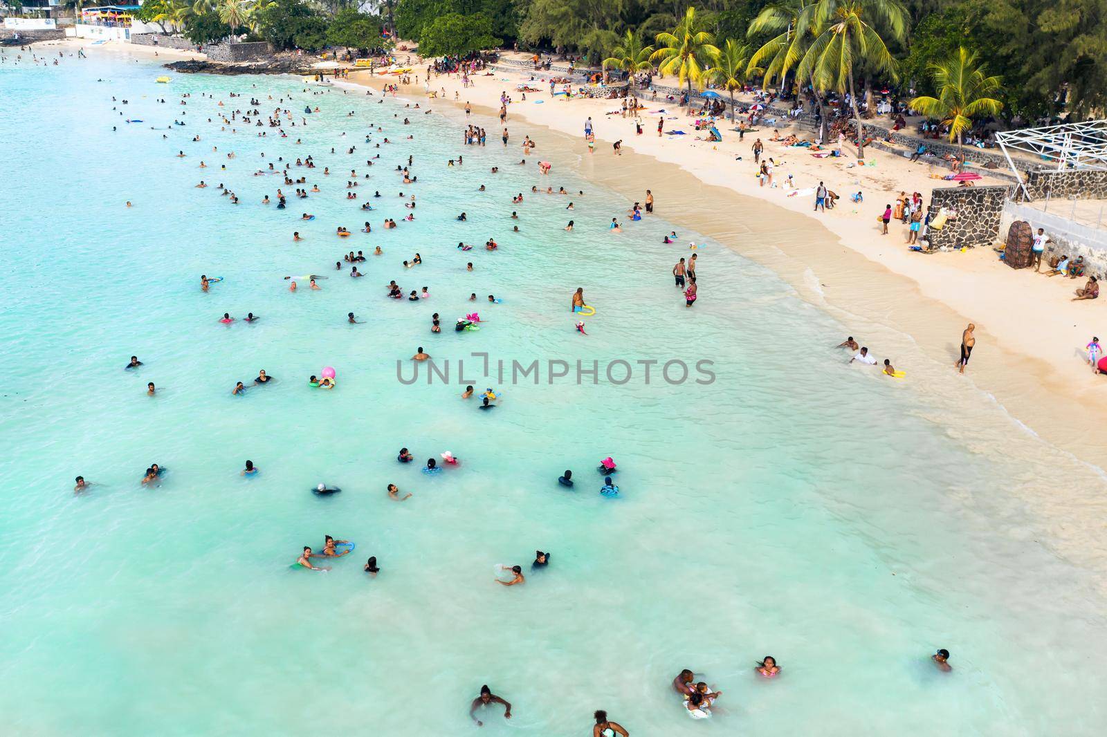 December 8, 2019. island of Mauritius, Locals relax on weekends and swim in the Indian Ocean by Lobachad