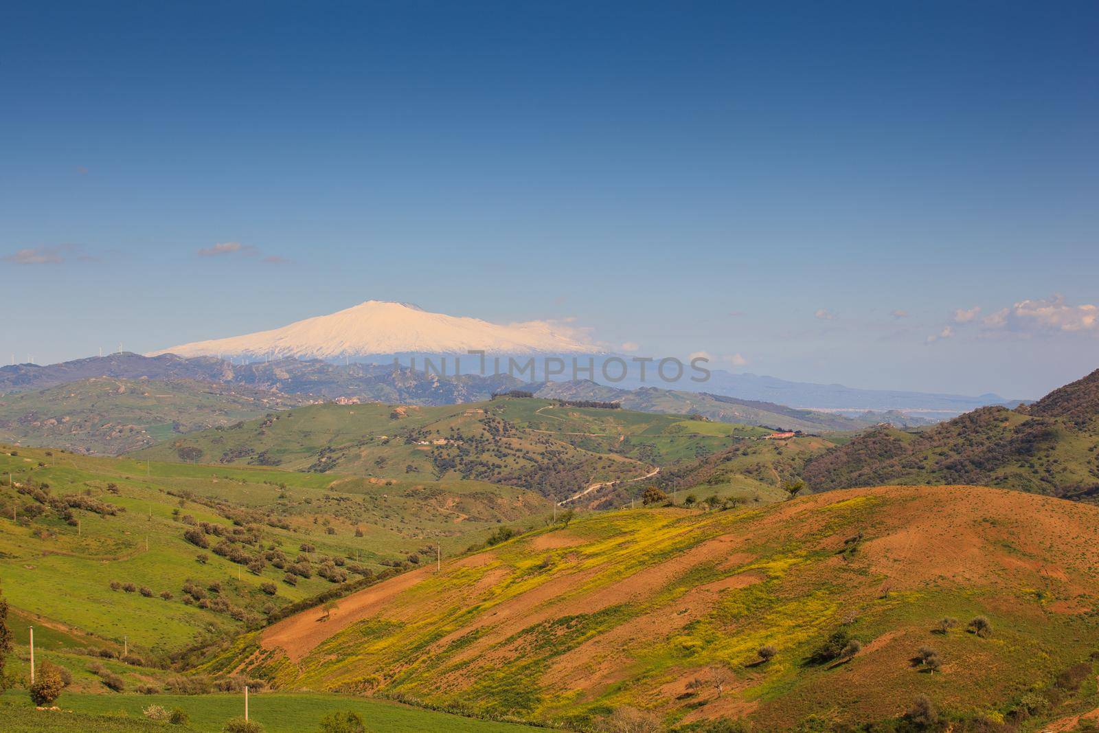 View of Etna volcano and Sicily field