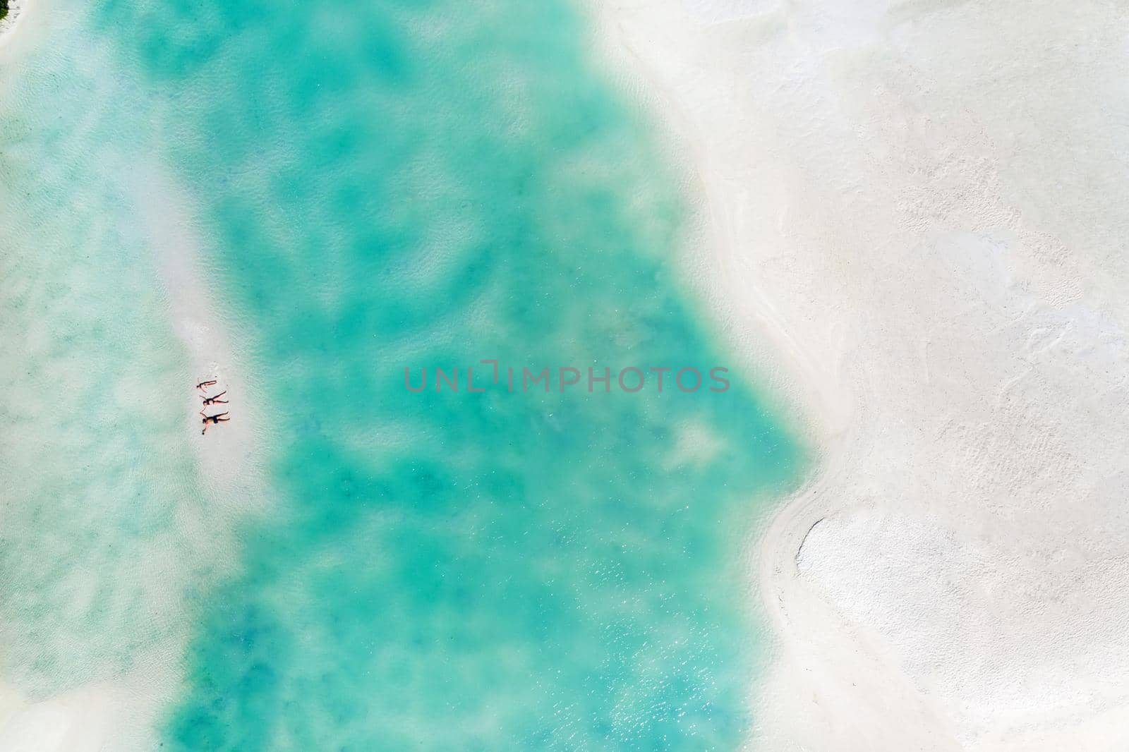 Young beautiful family with a child on a tropical vacation.mauritius island.