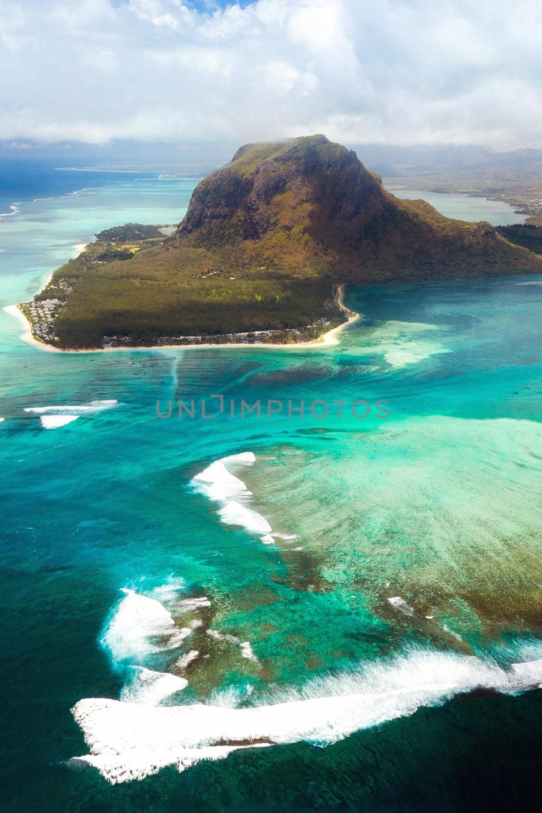 A bird's-eye view of Le Morne Brabant, a UNESCO world heritage site.Coral reef of the island of Mauritius.Storm cloud by Lobachad