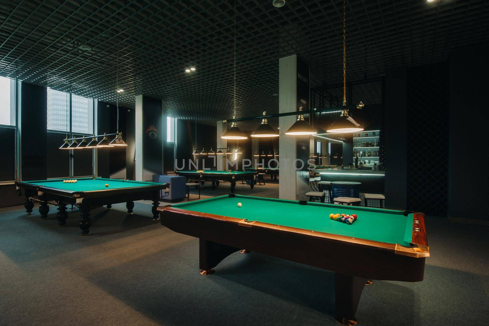 Billiard table with green surface and balls in the billiard club.Pool Game.
