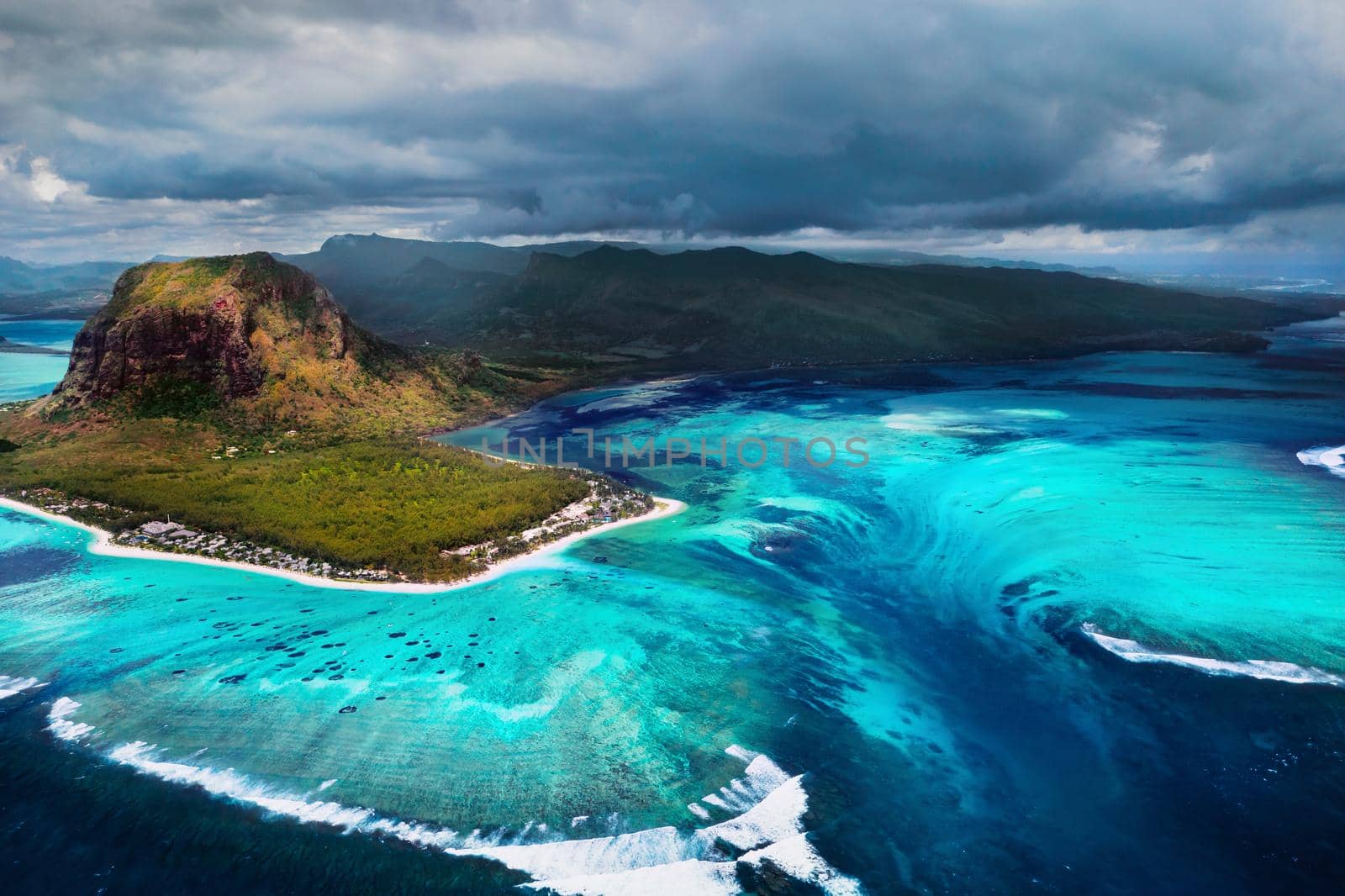 A bird's-eye view of Le Morne Brabant, a UNESCO world heritage site.Coral reef of the island of Mauritius.Storm cloud.