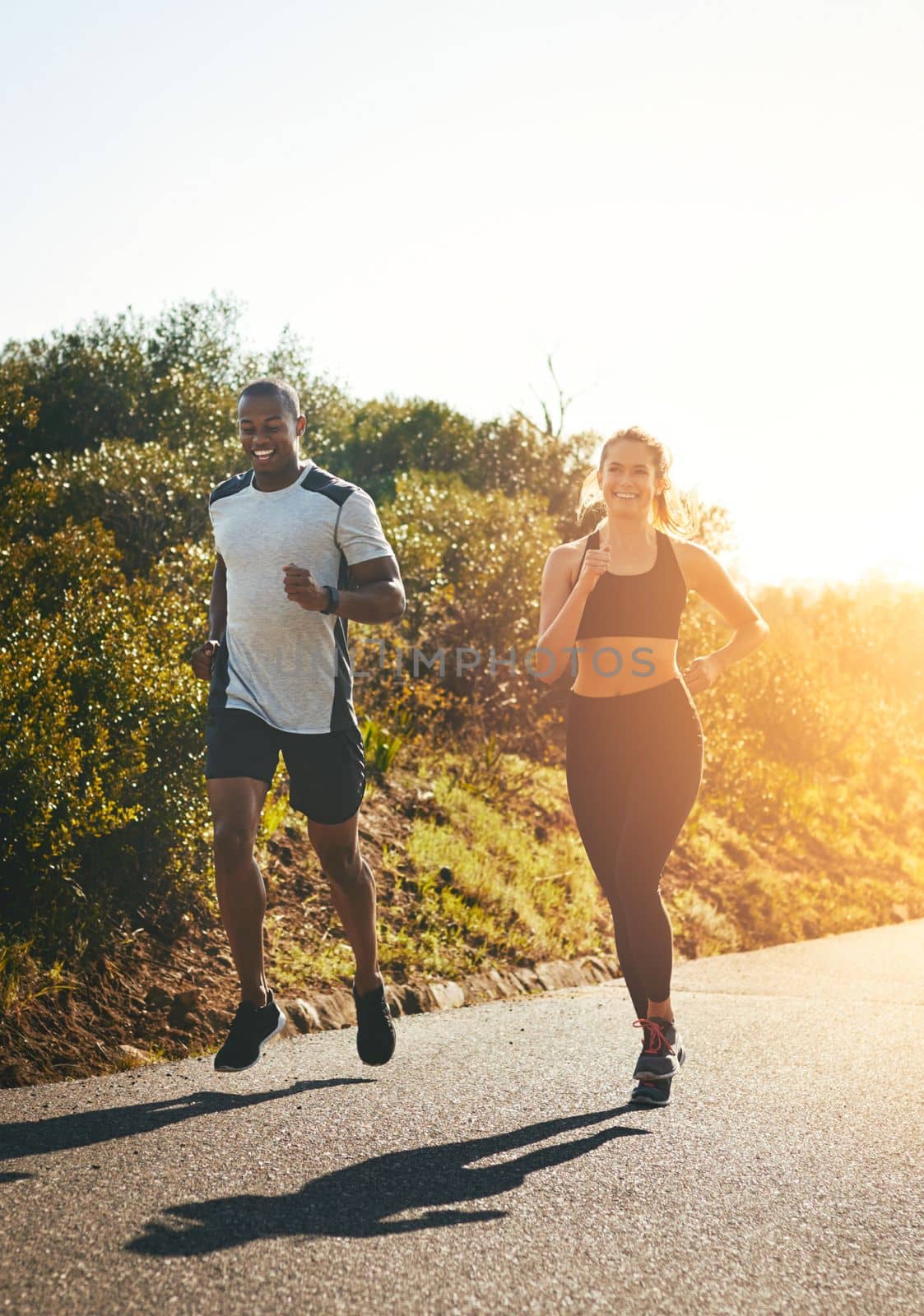 Just keep running. a fit young couple going for a run outdoors